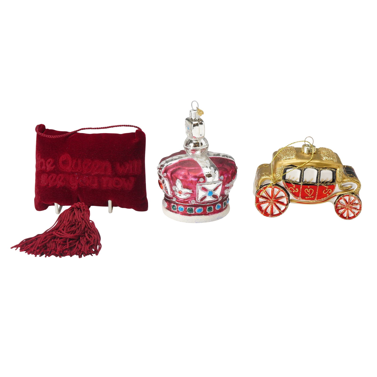3pc Royal Family Themed Christmas Tree Ornaments: This collection of three Royal Family-themed Christmas tree ornaments features distinct regal designs. The first piece is a maroon pillow-shaped ornament that displays the phrase, "The Queen will see 