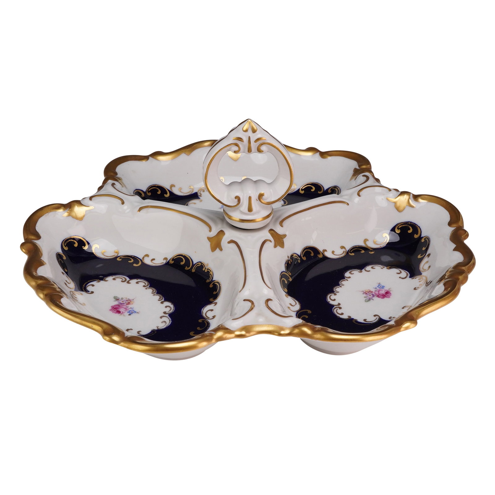 Reichenbach Echt Kobalt Porcelain Gilded Tripartite Serving Dish: Three-lobed dish with three wells joined by a central upright scrolling handle, designed with scalloped and molded edges. Decoration consists of a deep cobalt blue glaze with gilt scrolling borders an