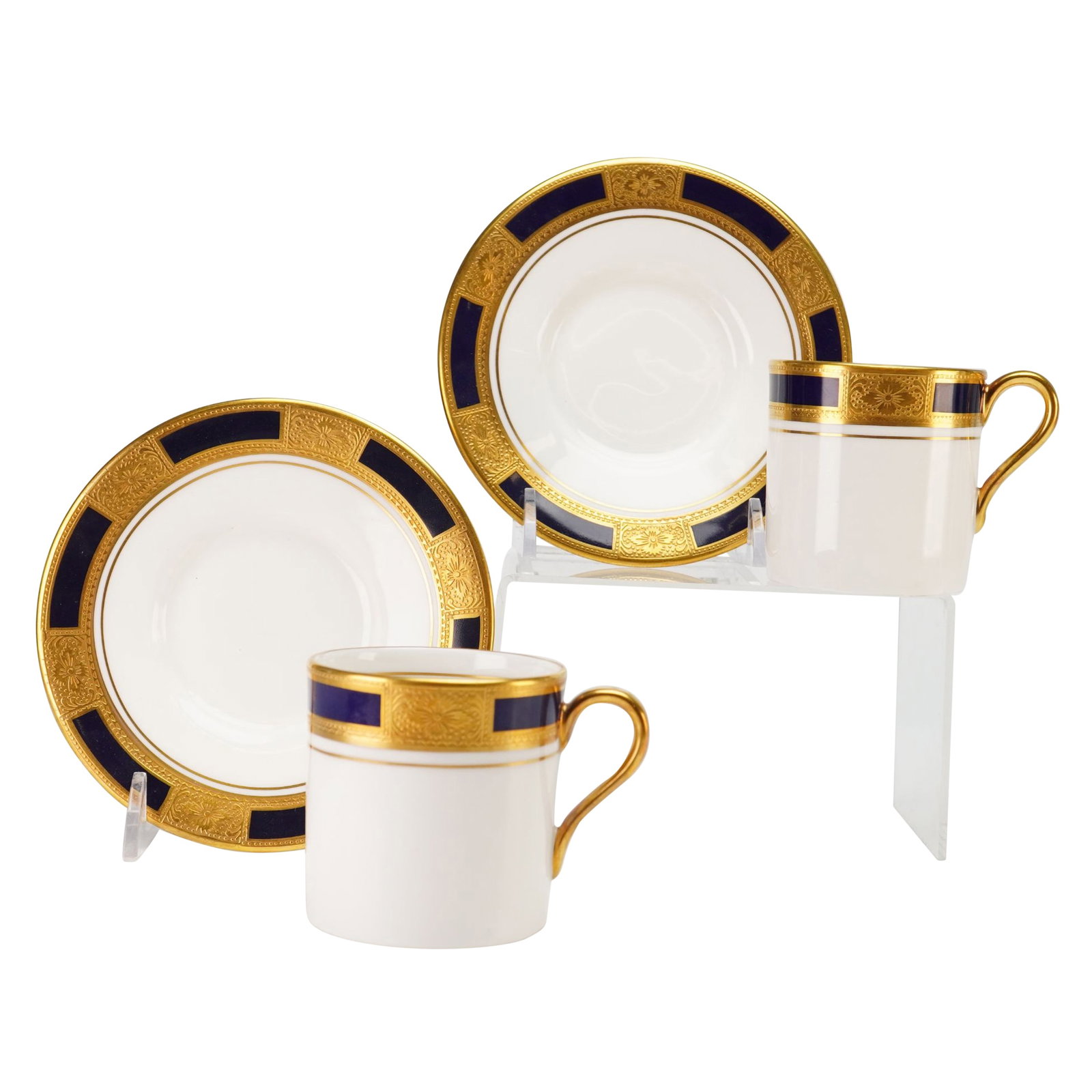 Aynsley Empress Cobalt Bone China Cup and Saucer Set: A set of fine English bone china cups and saucers manufactured by Aynsley in the Empress Cobalt pattern. The design features a formal and highly ornate border characterized by alternating panels of de