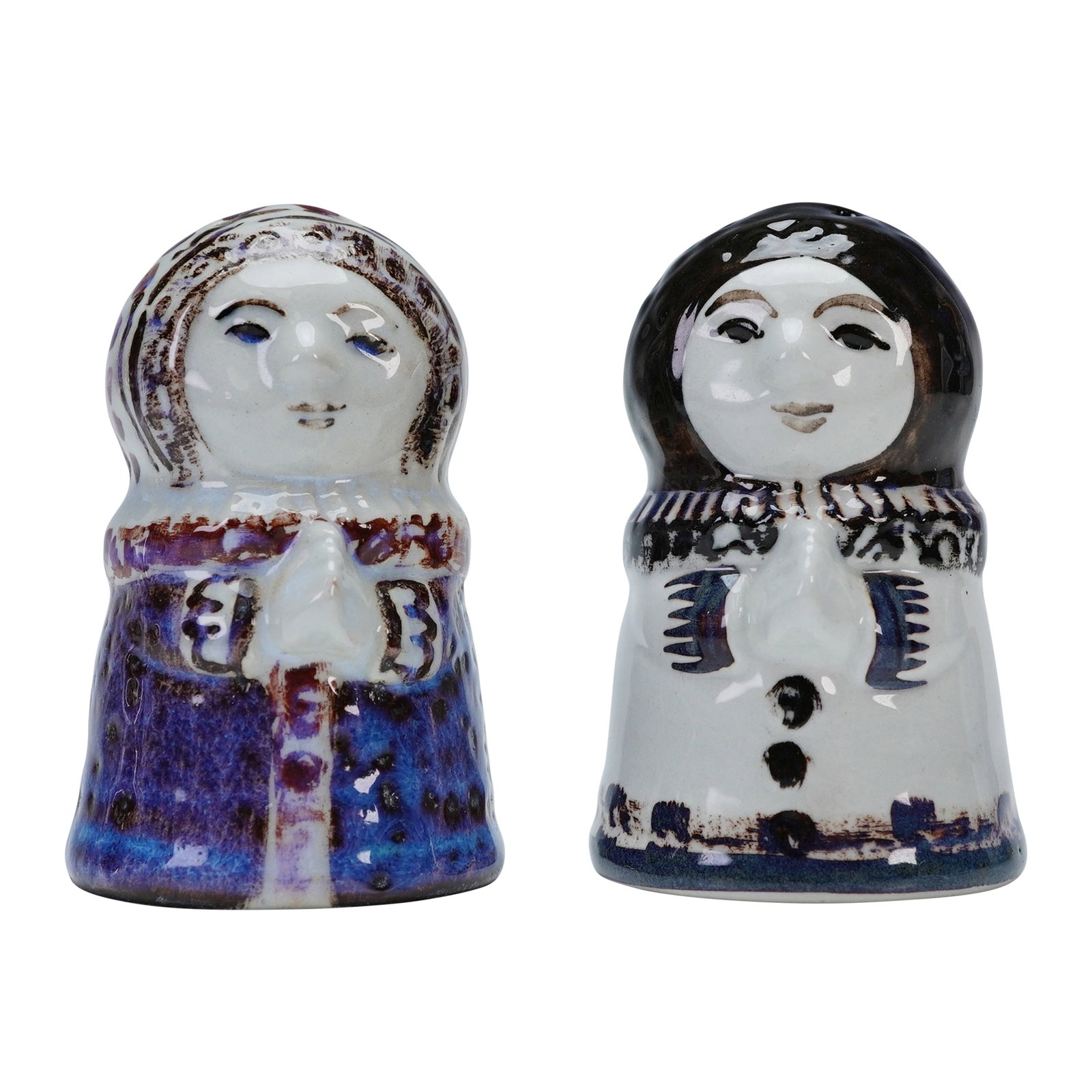 2pc Royal Copenhagen by Doreen Middelboe Salt and Pepper Shakers: Two faience salt and pepper shakers formed as stylized girls in prayer with clasped hands. Decorated in rich cobalt, plum, and earthy glazes. Each designed in a limited edition, one marked 307 of 3573