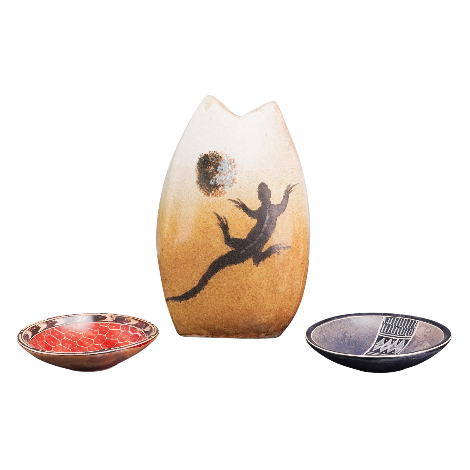 Three Vintage Studio Pottery Items, Lizard Motif Vase and Two Finger Bowls: The vase features a tapering ovoid body with a bifurcated notched rim and a matte gradient glaze transitioning from a creamy off-white to a mottled golden-amber tone. The face of the vase is decorated