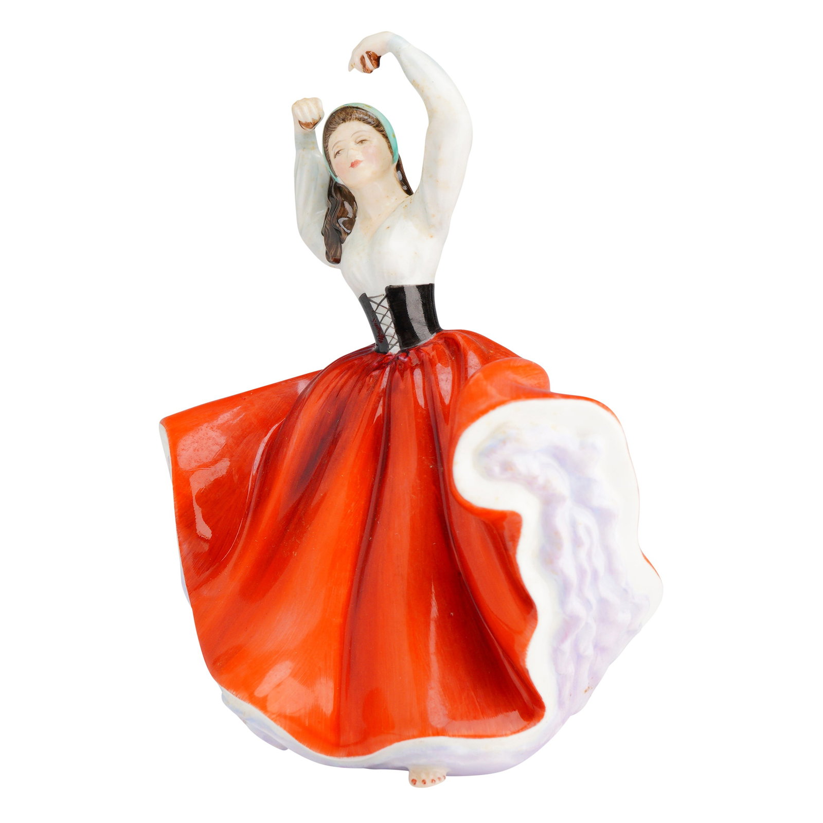 Royal Doulton Figurine, Karen HN2388: The figure depicts a female dancer captured in a dynamic pose with arms raised. The figure is modeled wearing a white blouse, a black laced corset, and a voluminous, richly glazed orange-red skirt lin