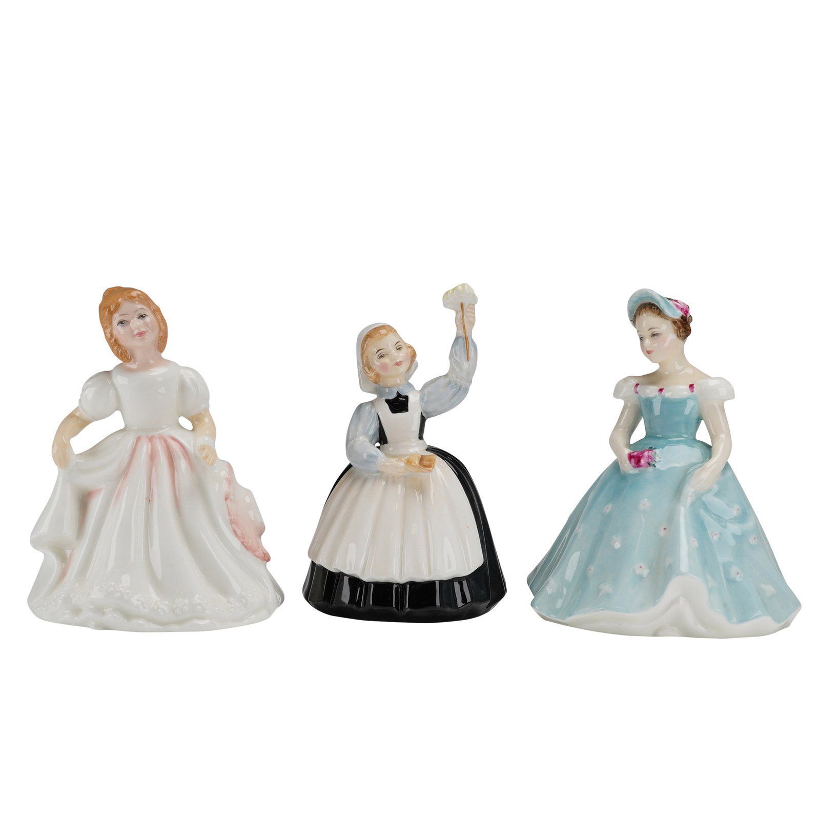 3pc Royal Doulton Figurines, Amanda, The Bridesmaid and Mother's Help: A trio of Royal Doulton fine bone china figurines featuring hand-painted glossy finishes. The collection includes Amanda HN2996, dated 1983, wearing a white dress with pink accents; Mother's Help HN21