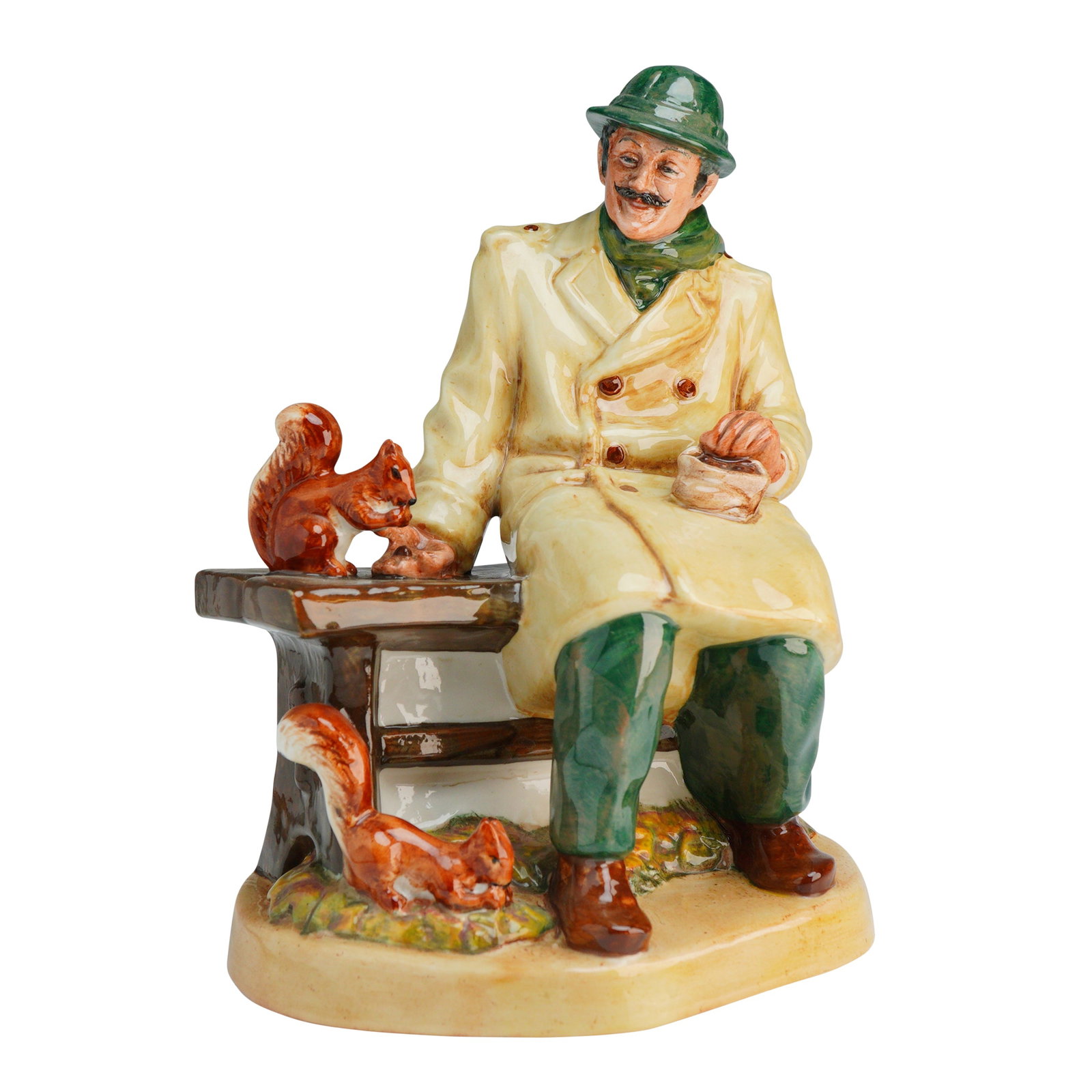 Royal Doulton Figurine Lunchtime HN2485: The figure depicts a mustachioed man seated on a park bench, wearing a green hat and scarf, a cream-colored double-breasted overcoat, and green trousers. He is shown holding a small bag of food while 