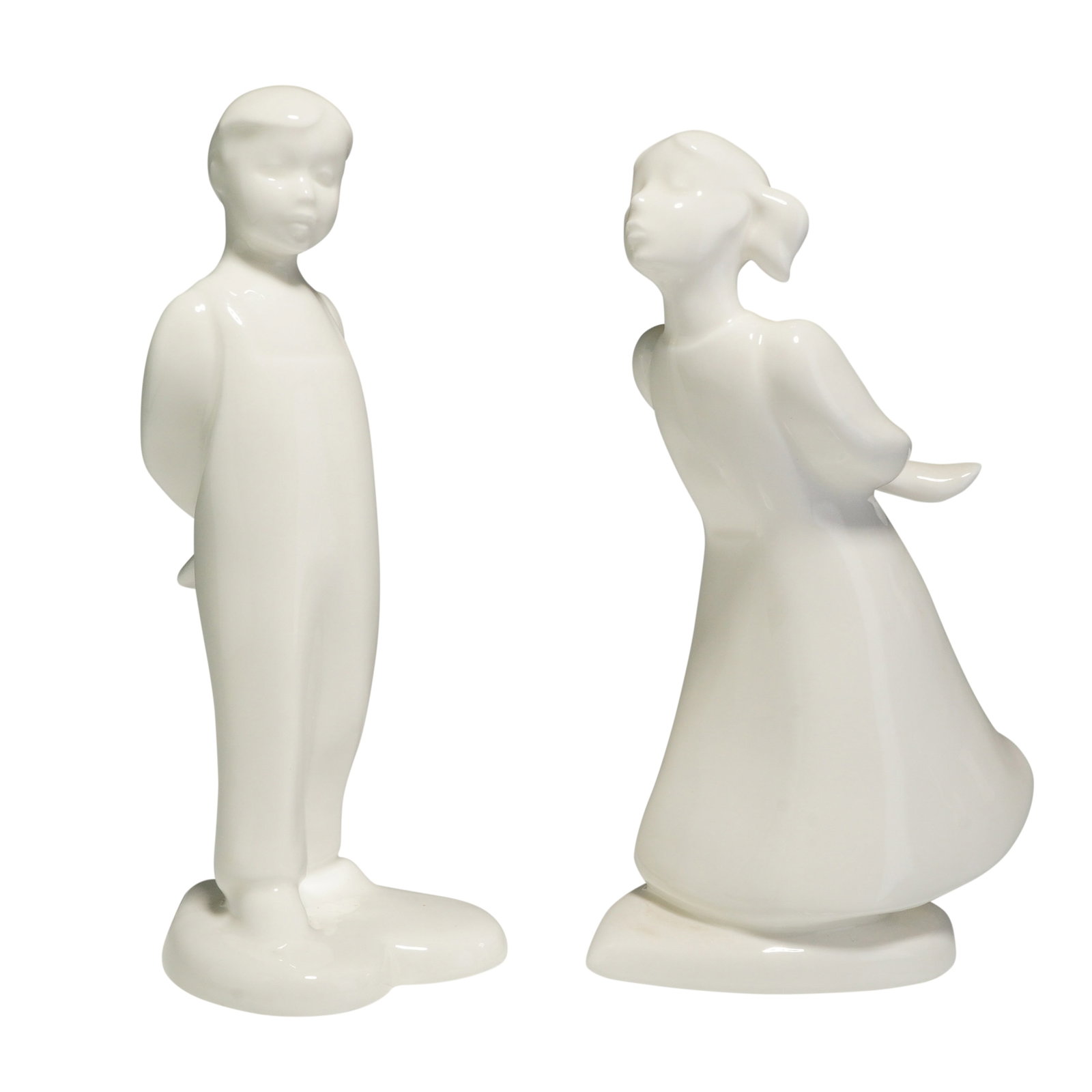 2pc Royal Doulton Figurines, The Kiss Boy HN4064 and The Kiss Girl HN4065: This 2pc set of Royal Doulton white glazed porcelain figurines is from the Images collection and titled The Kiss. The set comprises stylized figures known as The Kiss Boy HN4064 and The Kiss Girl HN40