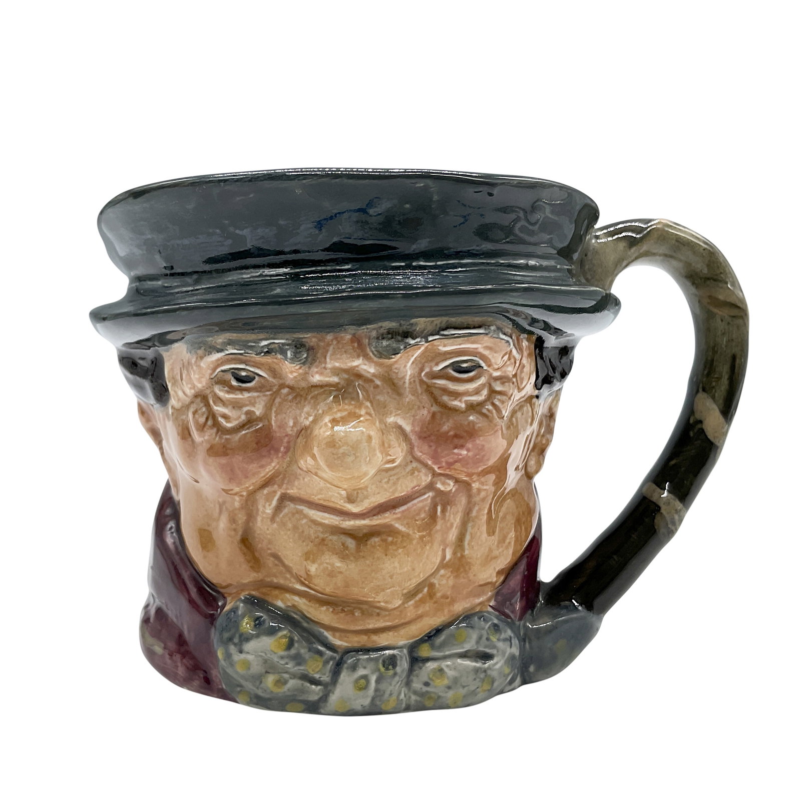 Tony Weller D5530 - Small - Royal Doulton Character Jug: Dark gray hat; maroon coat; gray-white bow with yellow spots. Royal Doulton backstamp. Artist: Leslie Harradine and Harry Fenton Dimensions: 3.25"H Date or Era: 1936 - 1960 Manufacturer or Brand: Roya