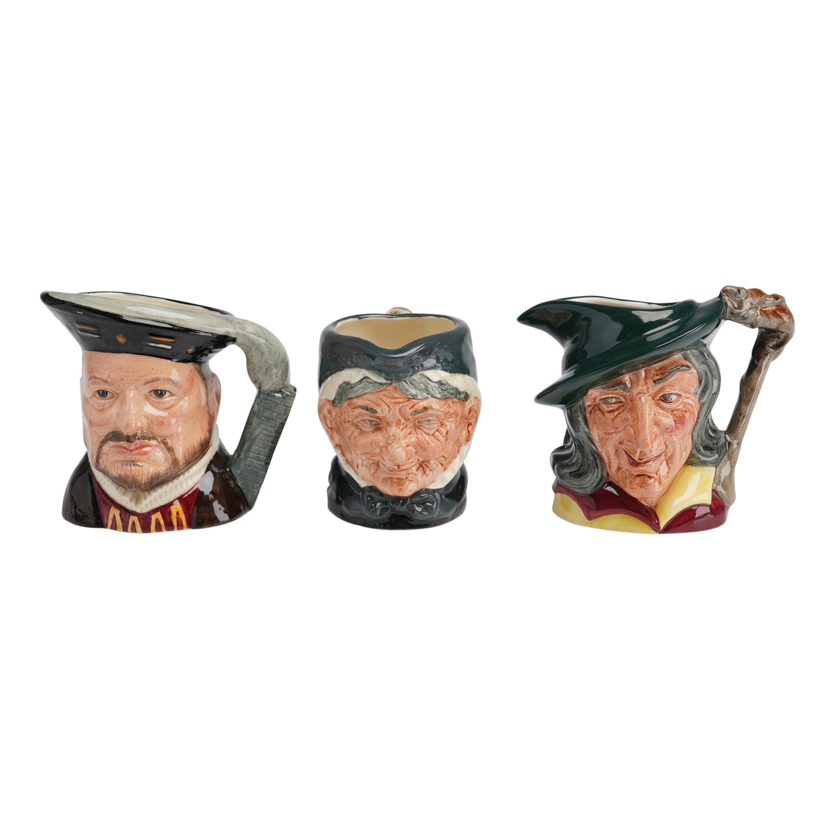 3pc Royal Doulton Character Jugs, Henry VIII, Granny, and Pied Piper: A trio of Royal Doulton glazed ceramic character jugs featuring the figures of King Henry VIII, Granny, and the Pied Piper. This set consists of hand-painted earthenware pieces, each displaying the sp
