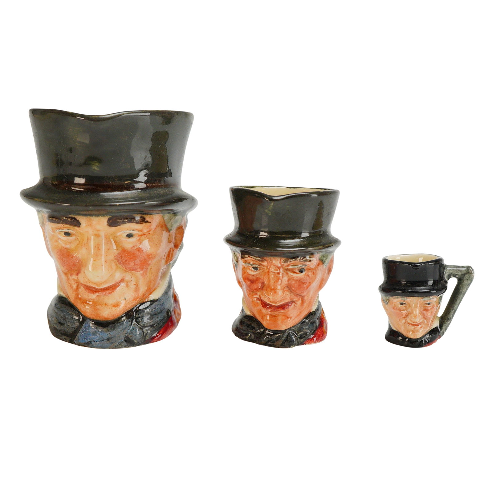 3pc Royal Doulton Character Jugs, John Peel: Three Royal Doulton character jugs in graduated sizes depicting the huntsman John Peel. These ceramic jugs are finished with a high-gloss glaze and depict the figure wearing a black top hat, red coat,