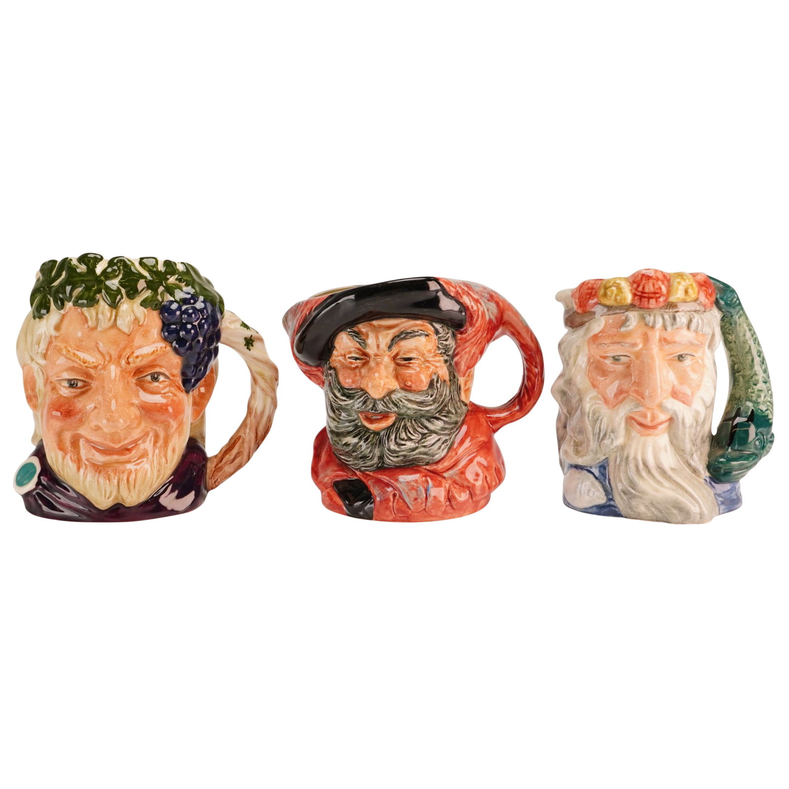 3pc Royal Doulton Small Character Jugs- D6505, 6385 and 6652: A trio of Royal Doulton glazed earthenware character jugs produced in England. Each jug is molded and finished with hand-painted underglaze decoration. The first jug depicts Bacchus, the Roman god of 