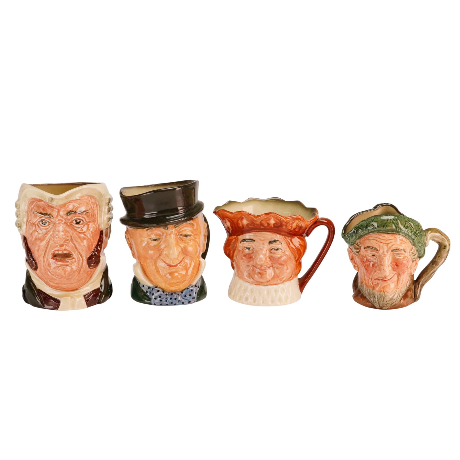 Lot of 4 Royal Doulton Character Jugs Including Owd Mac and Others: A lot of 4 Royal Doulton character jugs crafted from glazed earthenware with hand-painted overglaze detailing. The collection features figures in graduated sizes, including: The Lawyer, wearing a whit