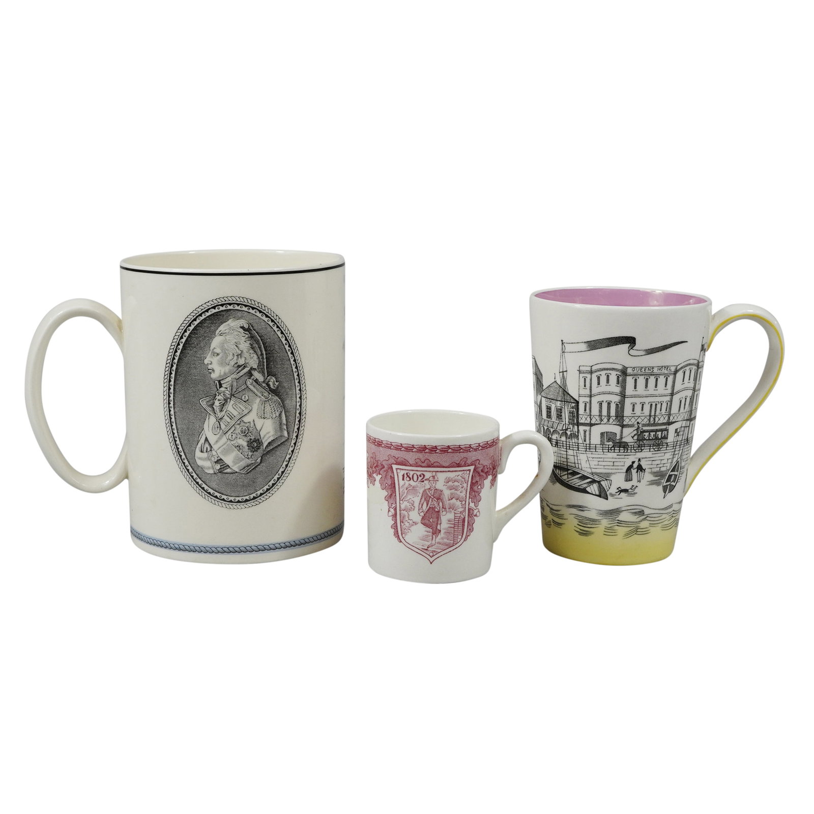 Three Wedgwood Etruria Transfer-Printed Ceramic Mugs: The largest item is a cylindrical Wedgwood Queen's Ware mug commemorating Admiral Lord Nelson and the Battle of Trafalgar. The exterior features a black transfer-printed oval medallion portrait of Nel