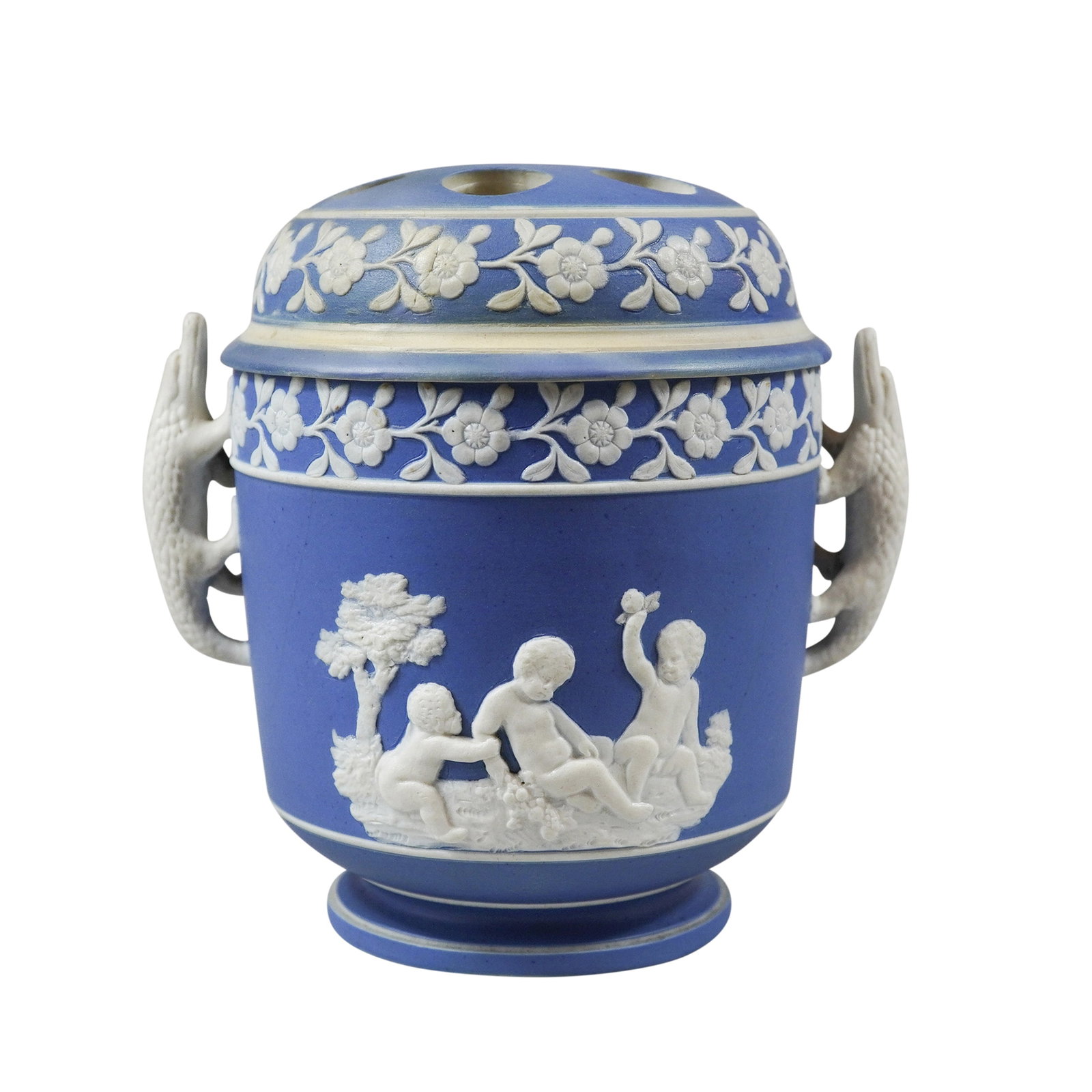 3pc Wedgwood Cobalt Blue Jasperware Pot-Pourri Urn: A three-piece jasperware pot-pourri urn or bough pot featuring a cylindrical body with twin handles modeled as alligators. The vessel is crafted in cobalt blue unglazed stoneware with white sprigged b