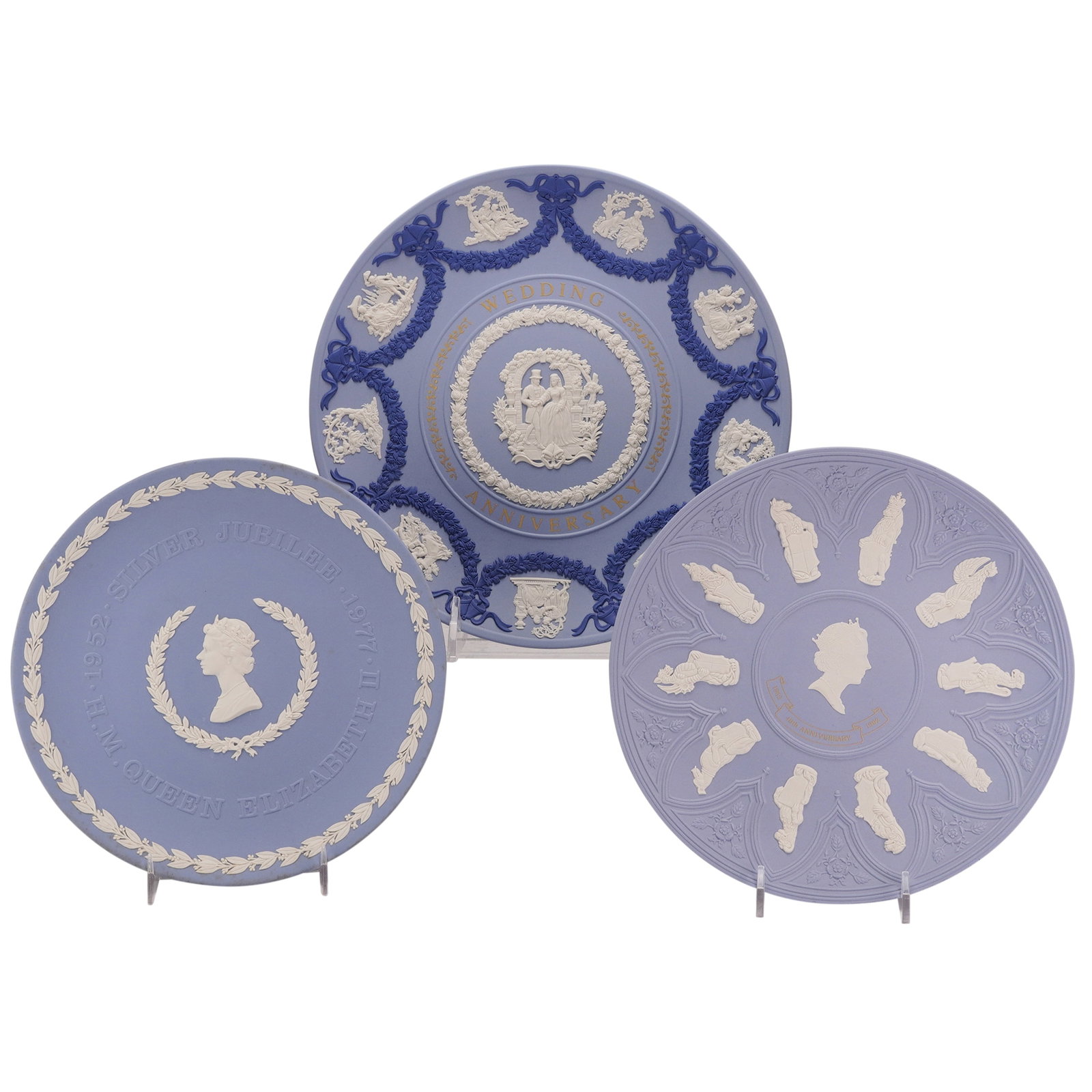 Three Wedgwood Blue Jasperware Royal Commemorative Plates: A trio of Wedgwood jasperware commemorative plates featuring motifs related to the British Royal Family. Each plate is constructed from matte-finish pale blue stoneware with sprigged bas-relief applic