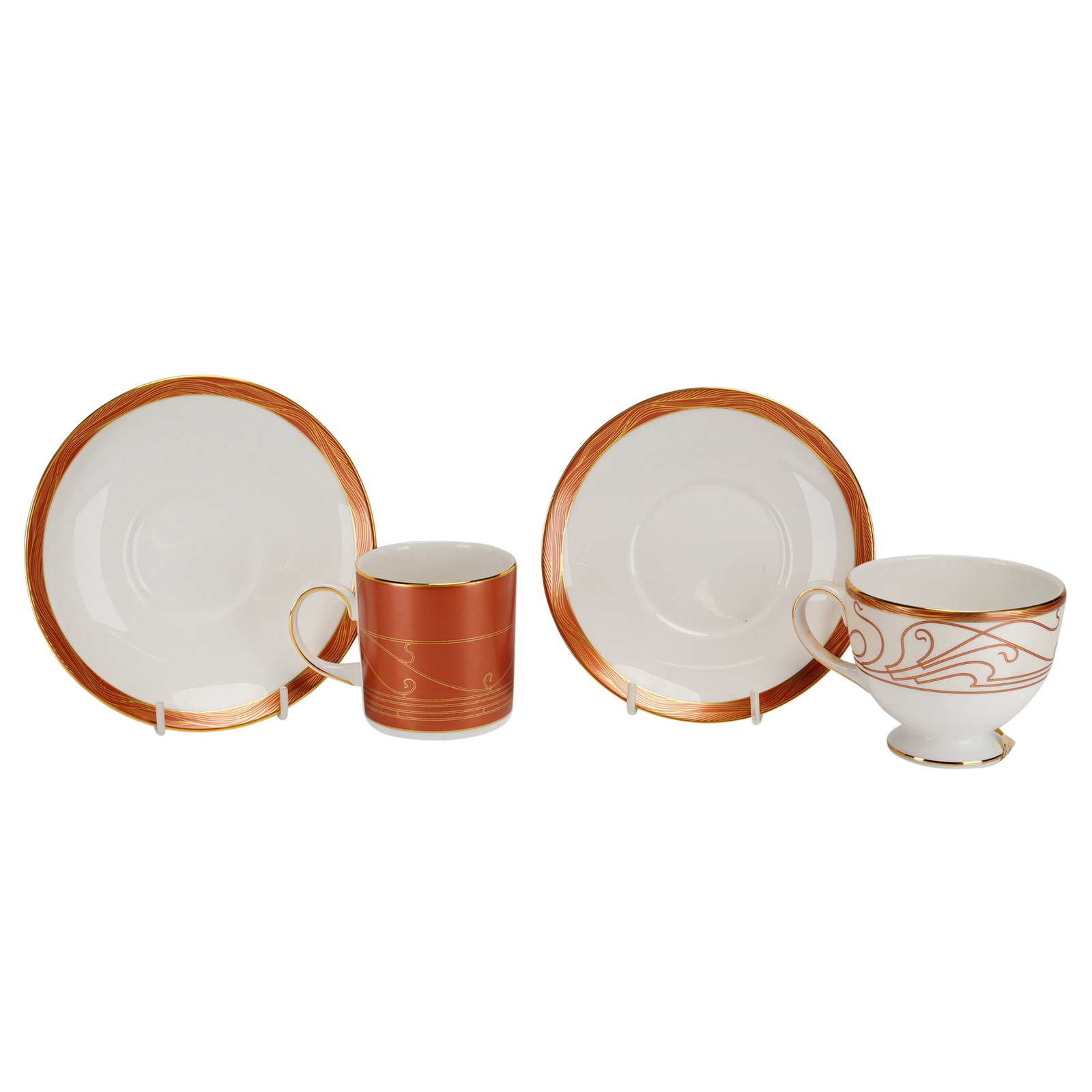 4pc Wedgwood Paris Pattern Demitasse and Teacup and Saucer Set: This 4-piece set of fine bone china is manufactured by Wedgwood in the Paris pattern. The set includes one cylindrical demitasse cup, one footed teacup, and two coordinating saucers. The design featur