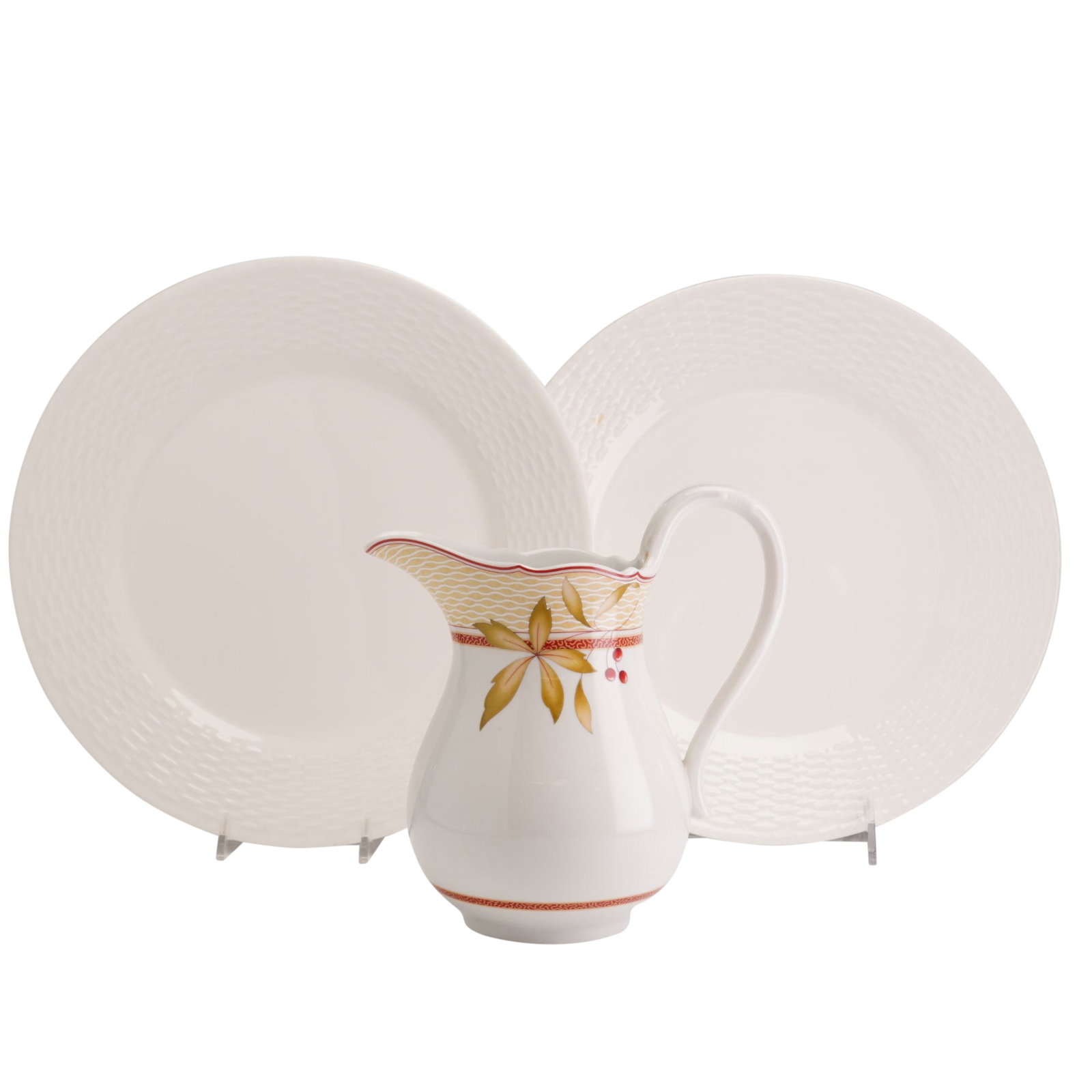Three Wedgwood Nantucket Pattern Plates and New England Collection Pitcher: This lot consists of three pieces of Wedgwood ceramic ware: two bone china plates and one fine porcelain pitcher. The two circular plates are in the Nantucket pattern, designed by George Davis, and fe