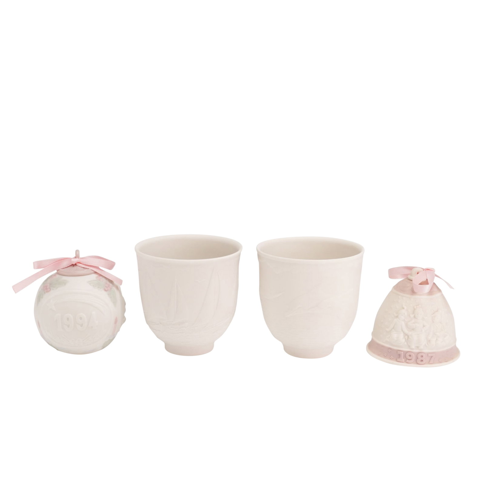4pc Lladro Porcelain Ornaments and Collectors Society Candle Holders: This lot features a collection of four matte white porcelain pieces by Lladro, manufactured in Spain. The grouping consists of commemorative holiday items and exclusive releases for the Lladro Collect