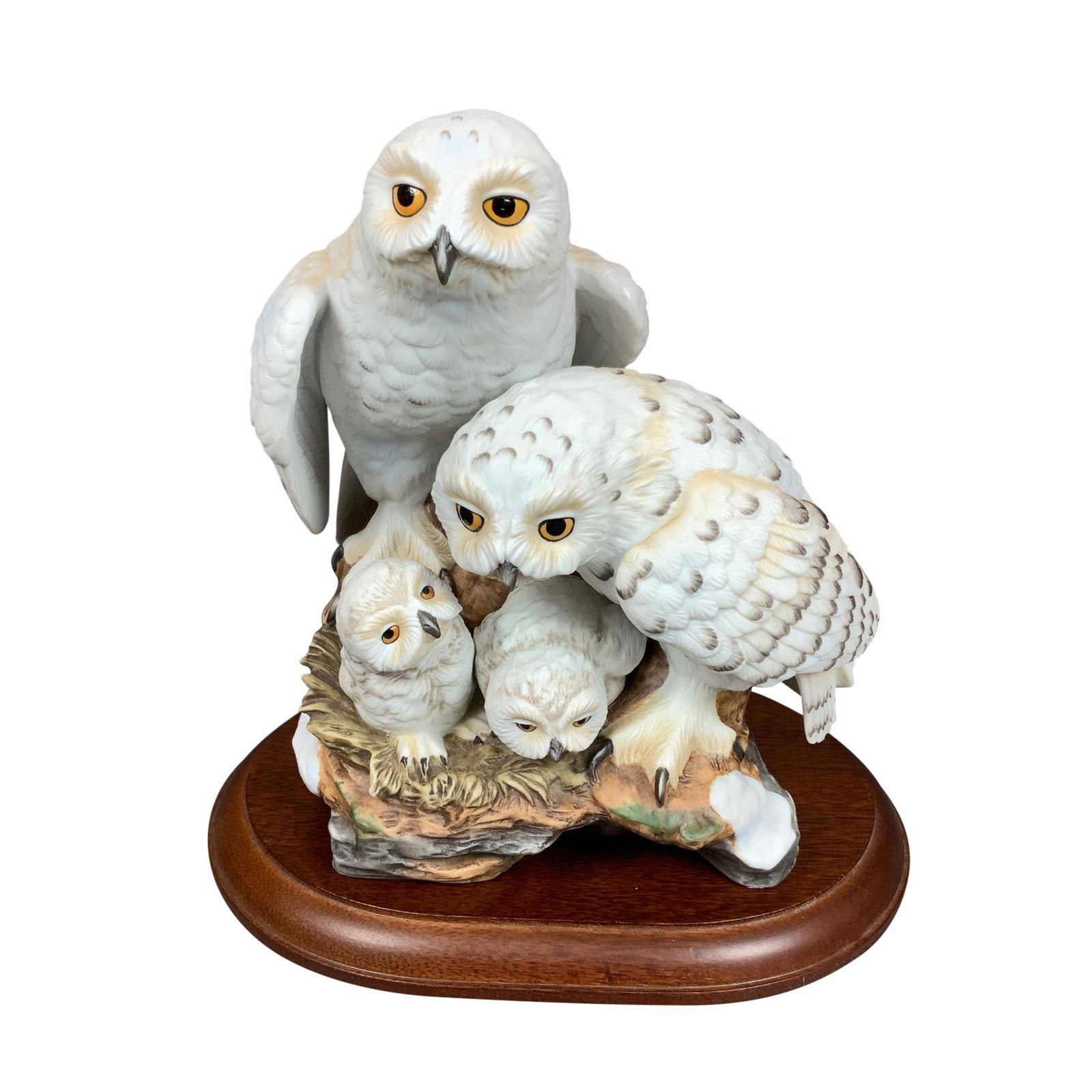Danbury Mint by Katsumi Ito Porcelain Figurine, Snowy Owls with Base: A hand-painted bisque porcelain figurine titled Snowy Owls, designed by artist Katsumi Ito for the Danbury Mint. This sculpture depicts a family of four snowy owls, including two adult birds and two c