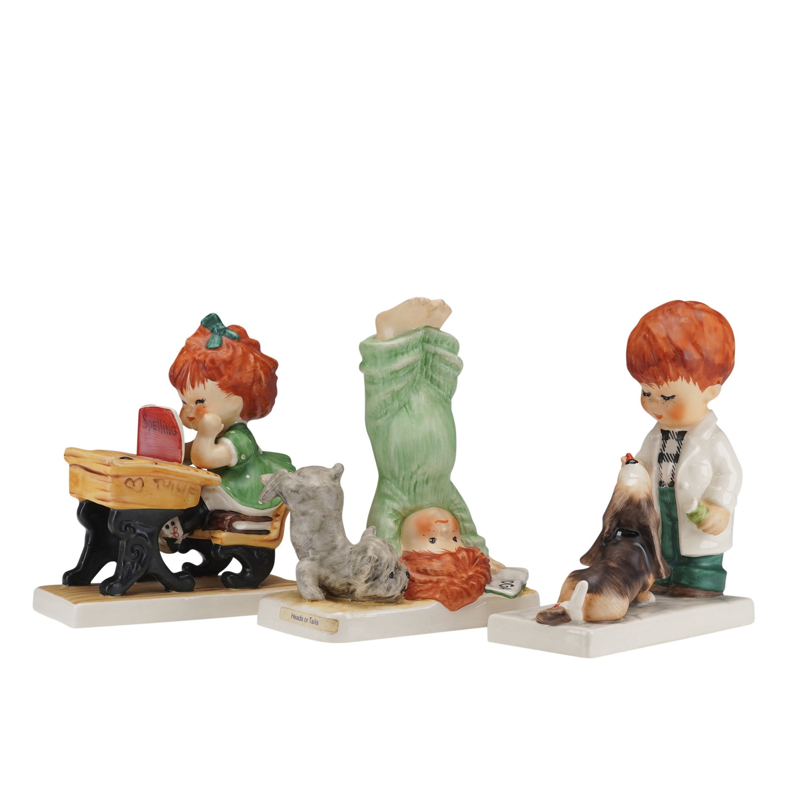 3pc Goebel Charlot Byj Assorted Children Figurines: Three hand painted adorable children figurines including Say A-A-A-AAH, Spellbound, and Heads or Tails. Depicts red head children in various poses. Charlot Byj stamped to base. Goebel backstamp. Dimen