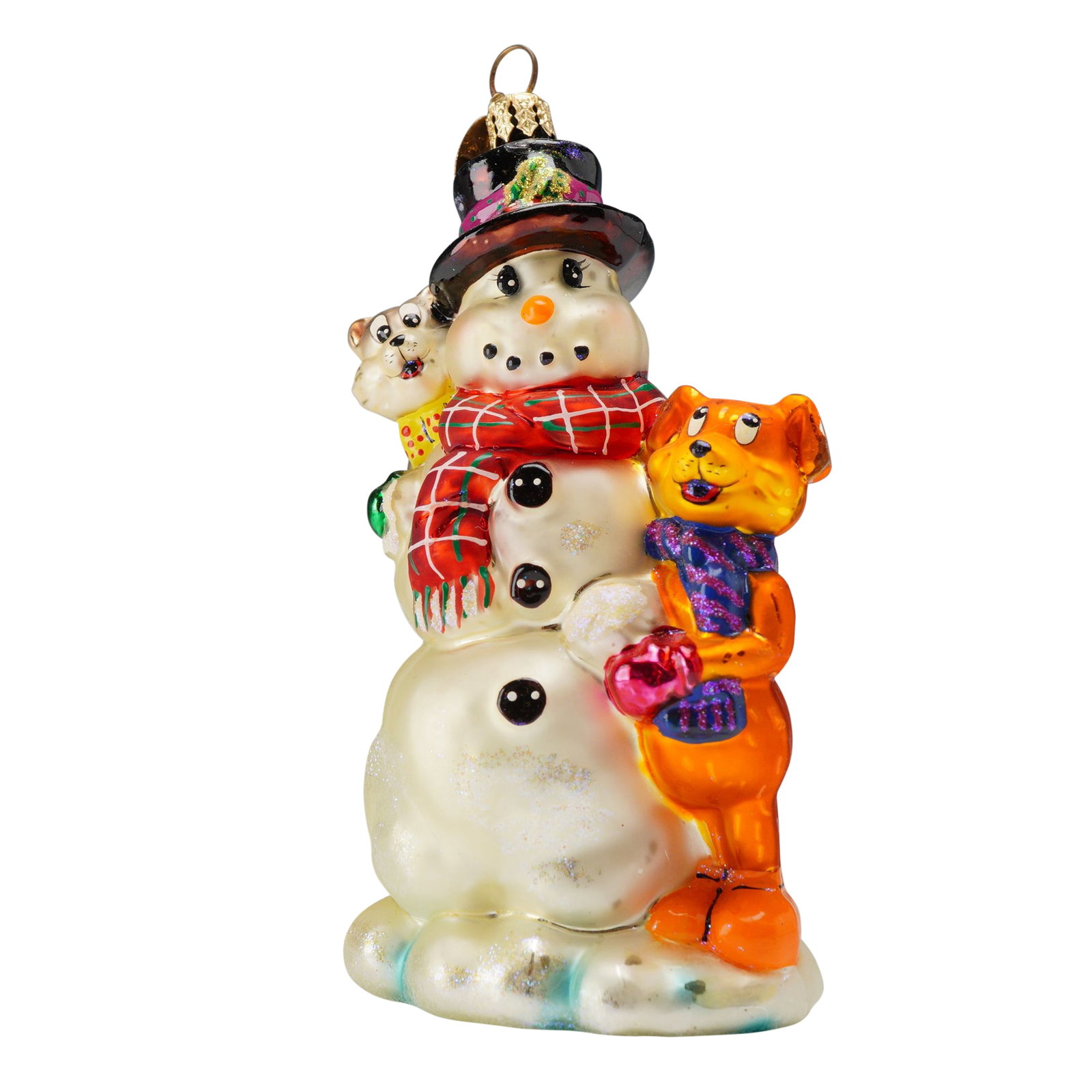 Christopher Radko Snowman and Pet Pals Christmas Tree Ornament: This Christopher Radko glass Christmas ornament features a festive winter scene with a classic snowman and two animal companions on a snow-covered base. The snowman is dressed in a traditional black t