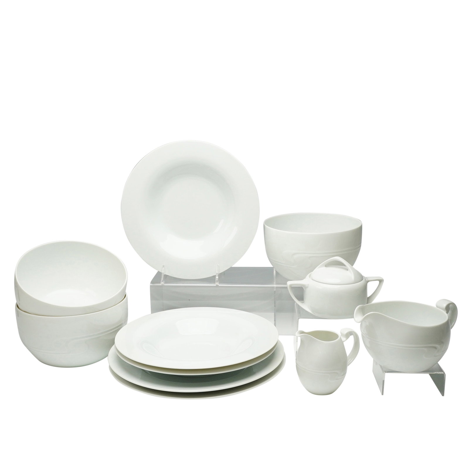 Coll. of 11 Rosenthal studio-linie Asimmetria Porc. Tableware Items: A collection of 11 items of white porcelain tableware from the Rosenthal studio-linie, in the Asimmetria pattern designed by Bjorn Wiinblad. The set is executed in a stark white glaze and features the