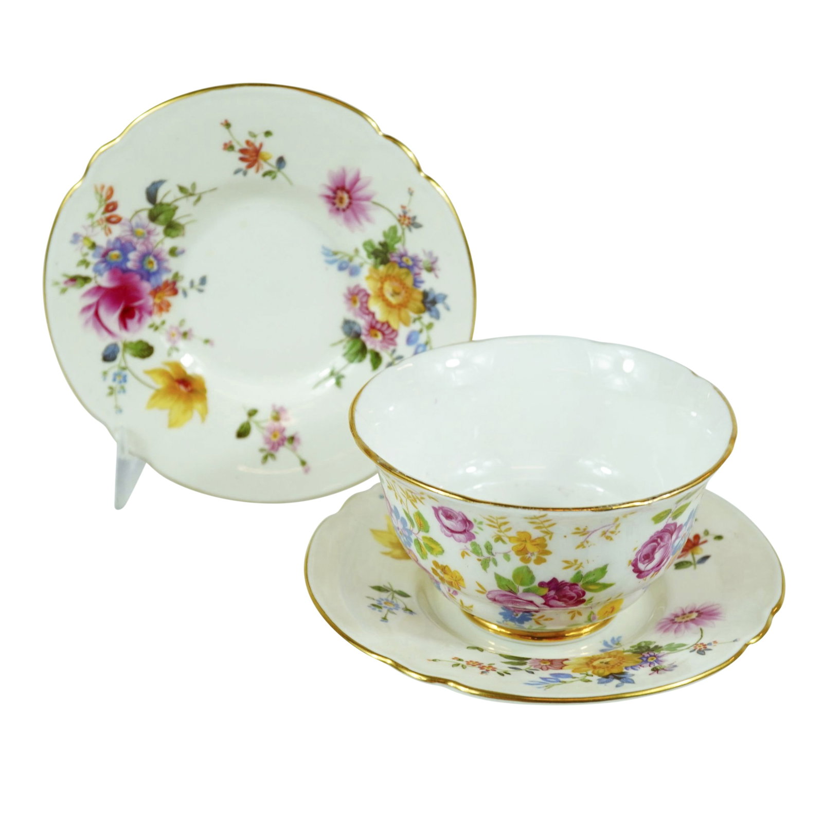 3pc Royal Stafford June Roses Bowl and Royal Crown Derby Derby Posies Saucers: Royal Stafford June Roses and Royal Crown Derby Derby Posies are the patterns identified for this three-piece ceramic lot. The set consists of one handleless tea bowl and two saucers. The tea bowl, in