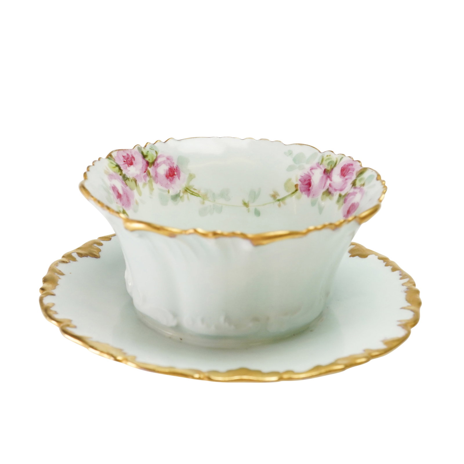T&V Limoges France Porcelain Bowl with Attached Underplate: A Tressemann and Vogt (T&V) Limoges porcelain bowl with an attached underplate. The piece features a pale mint-green glaze on the bowl exterior and the upper surface of the underplate. The interior ri
