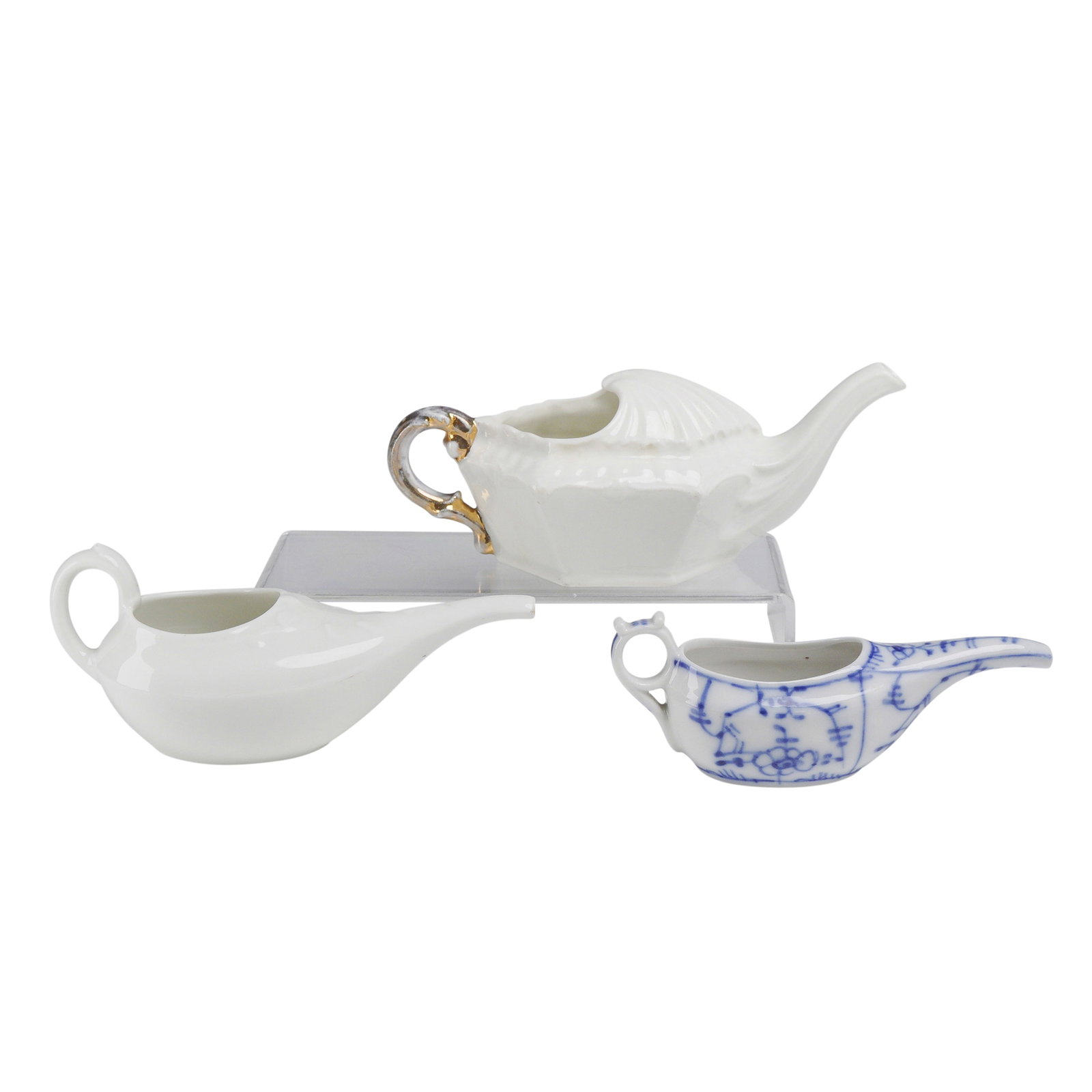 3pc Haviland and Co Porcelain Invalid Feeder Pots: A collection of three porcelain invalid feeders, also known as pap boats, used historically for administering liquids or soft foods. The group includes one white porcelain feeder with a hexagonal body