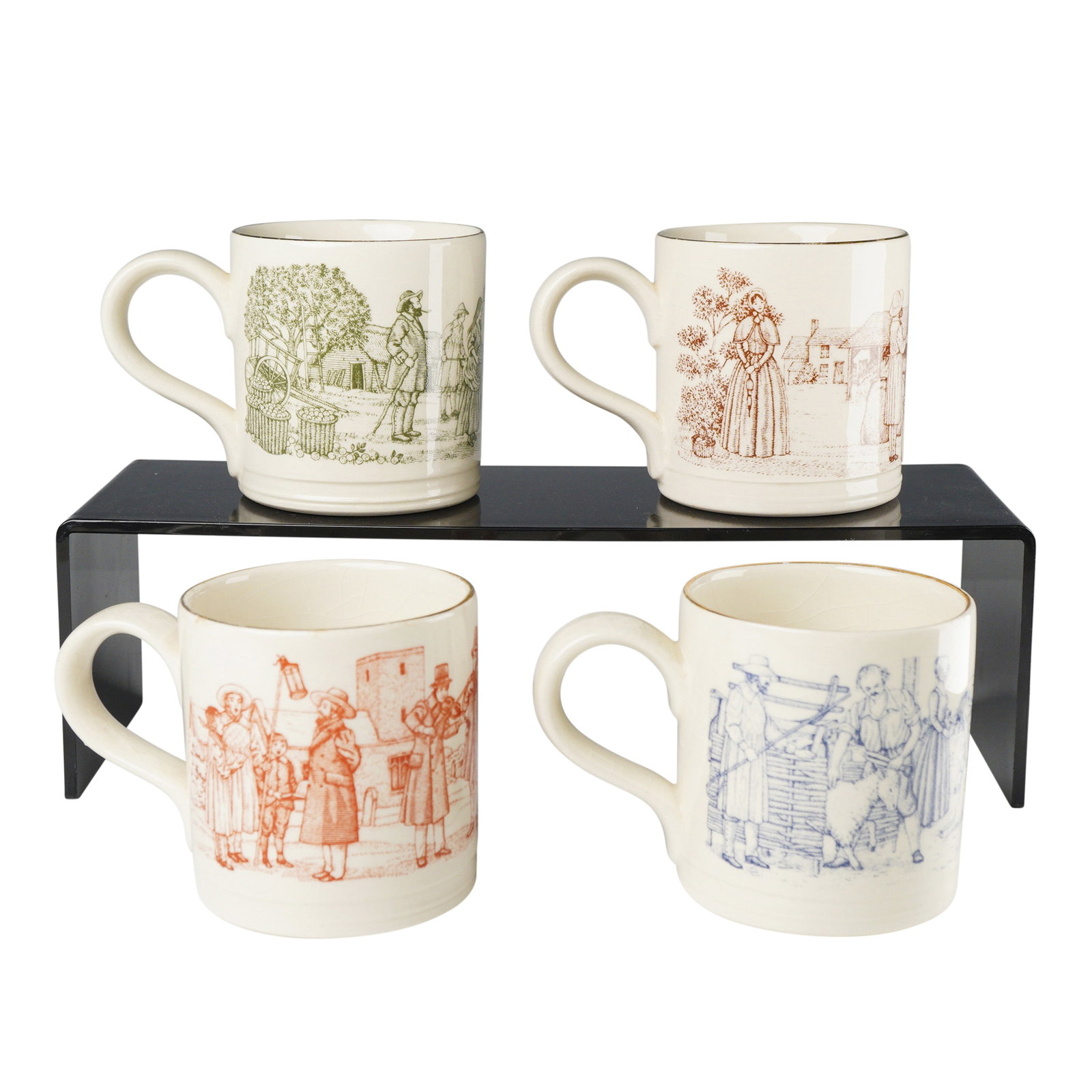4pc Boncath Pottery Thomas Hardy Novel Mugs: A collection of four cream-colored earthenware handled mugs produced by Boncath Pottery, Staffordshire for The National Trust. The mugs are decorated with monochromatic transfer prints, each depicting