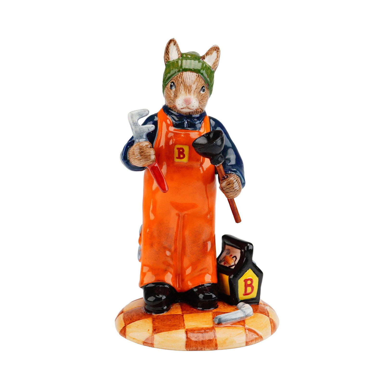 Royal Doulton Prototype Plumber Bunnykins: Excellent prototype of a rabbit plumber in dirty orange coveralls with wrenches in his back pockets, an olive wool hat, and a dark blue work shirt with lighter blue elbow patches. He stands ready with