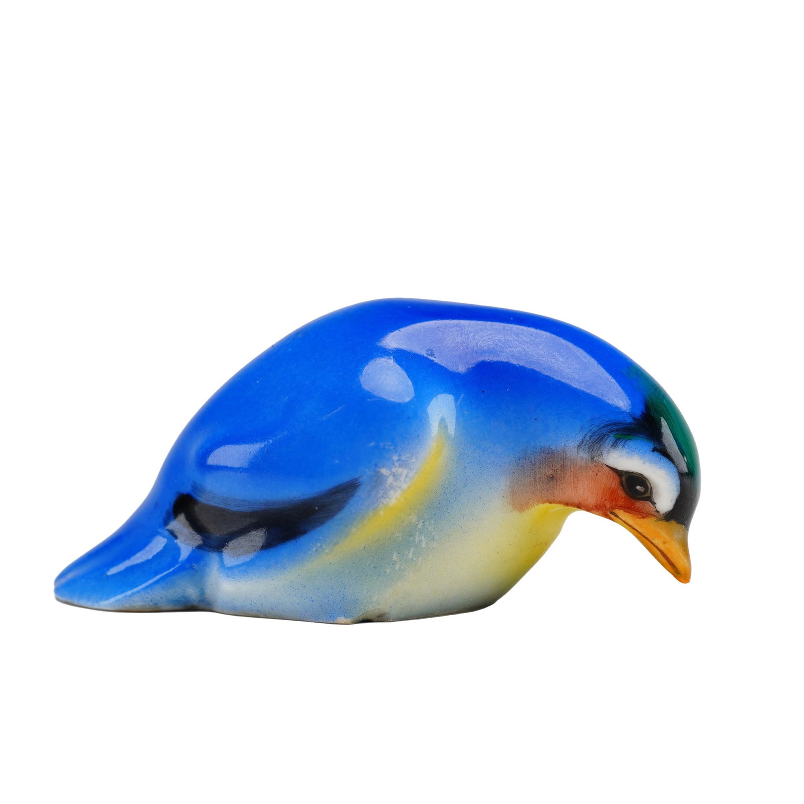 Royal Doulton Bird Figurine, Fledgling HN137B: Style two, blue and yellow coloration with black tips on the wings and a brown beak. Royal Doulton backstamp. Model 1238. Dimensions: 2.75"L x 1.25"W x 1.25"H Date or Era: 1917-1936 Manufacturer or Br