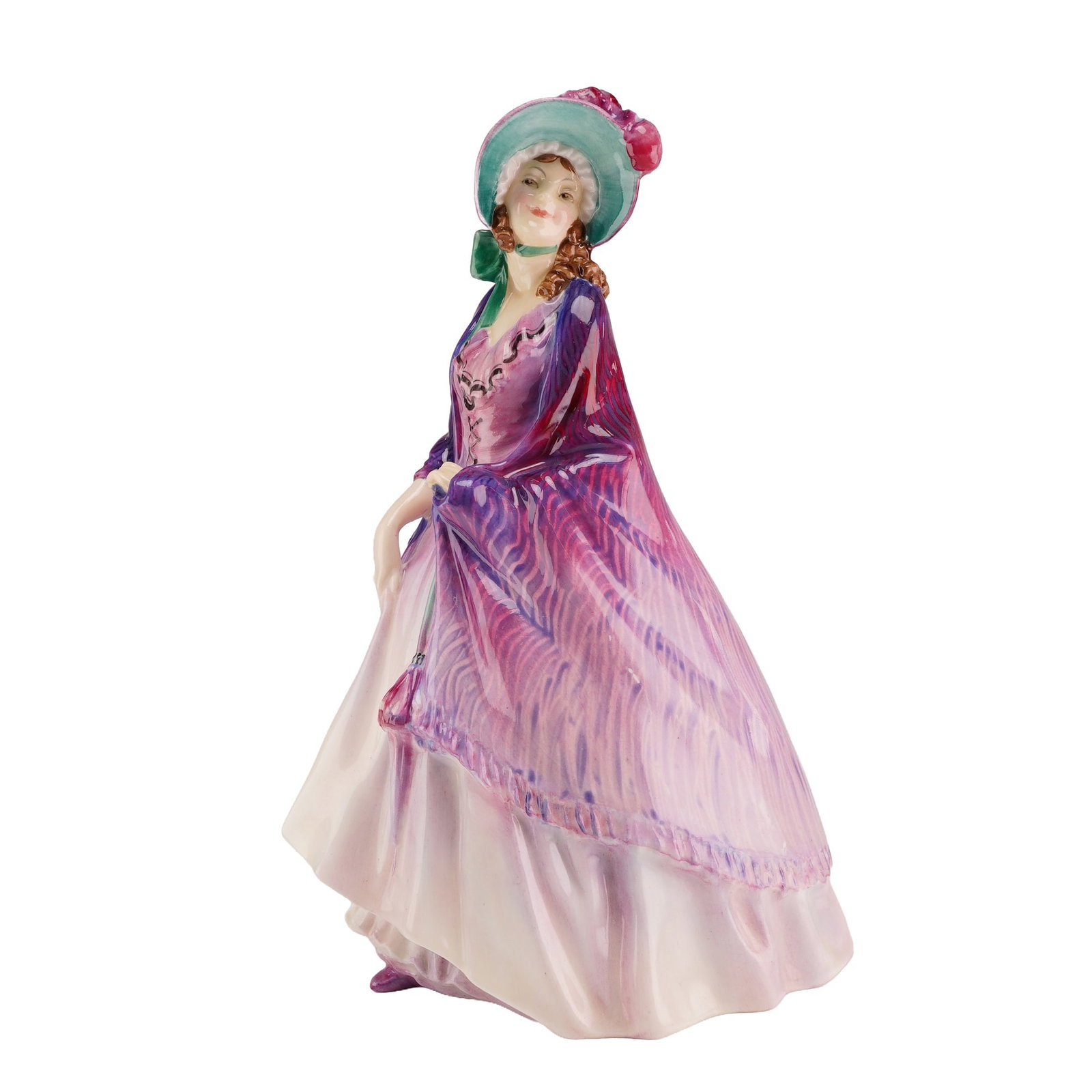 Royal Doulton by Leslie Harradine Bone China Figurine, The Paisley Shawl HN1707, Rare Version: The piece is constructed of polychrome hand-painted glazed fine bone china. It depicts a standing female figure in Regency-style attire, featuring a prominent draped shawl with a stylized paisley patt