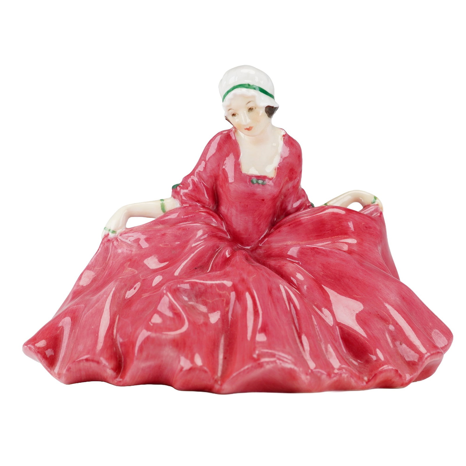 Royal Doulton Figurine, Polly Peachum Beggars HN569: A charming Royal Doulton Polly Peachum HN698, modeled in a vibrant crimson gown with exquisite hand painted details. This early 20th century figurine captures the elegance and grace of Polly with deli