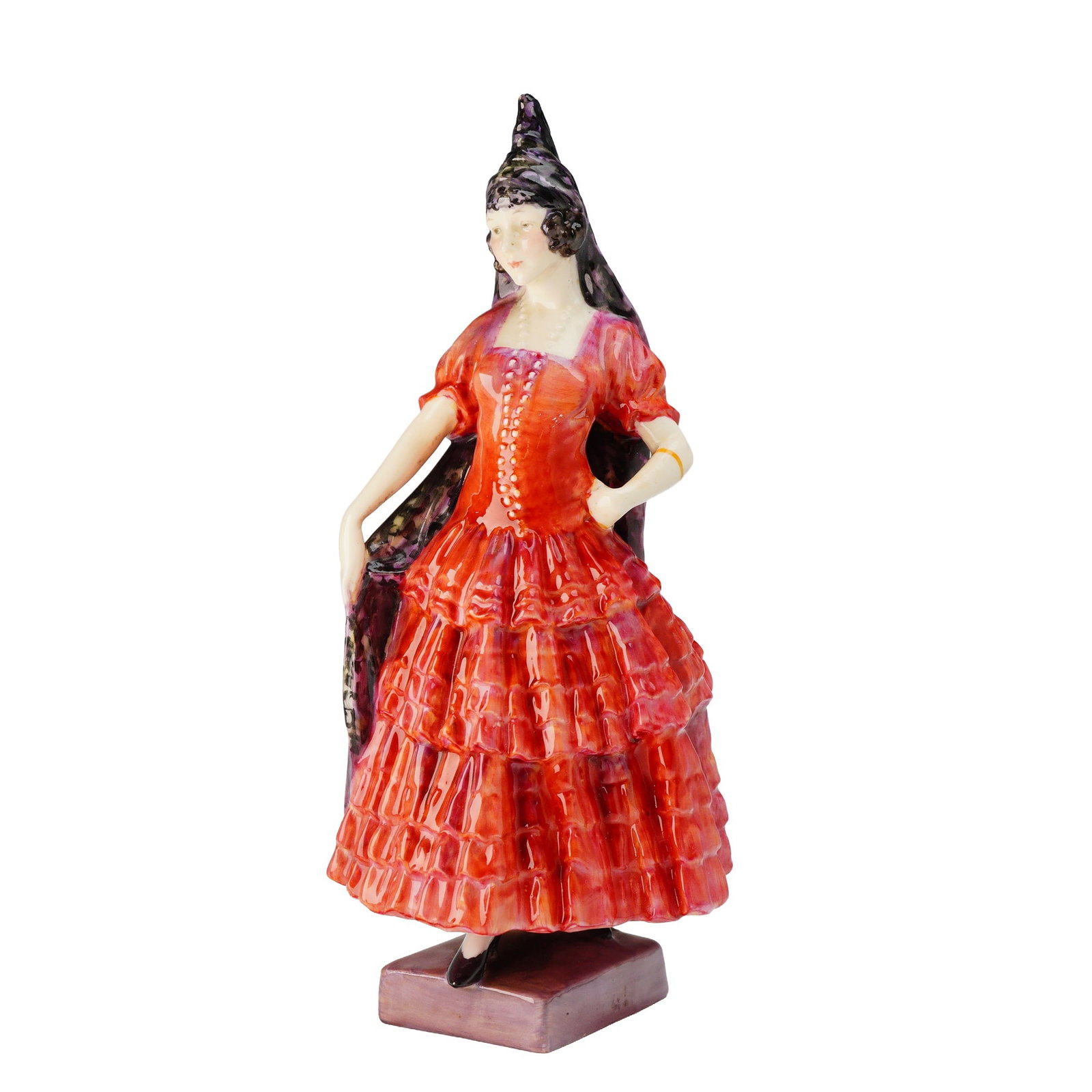 Royal Doulton Spanish Lady HN 1294 Porcelain Figurine: A single glazed porcelain figurine by Royal Doulton, identified as the model "Spanish Lady," HN 1294. The figure depicts a standing female dressed in a high-gloss tiered gown primarily in shades of ve