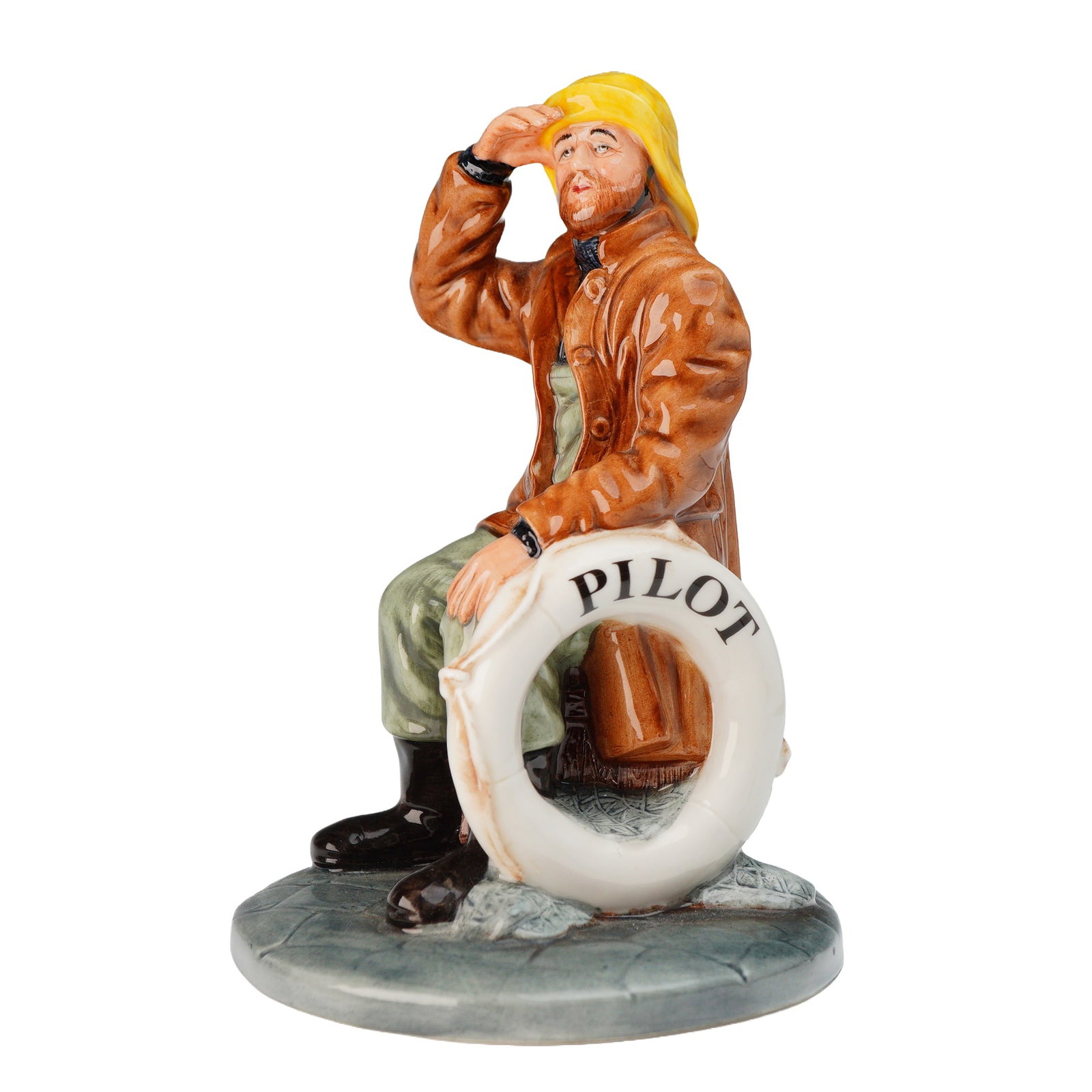 Royal Doulton The Pilot Skipper Figurine HN 4510: A single glazed bone china figurine, Royal Doulton The Pilot Skipper Figurine HN4510, from the Royal Doulton Classics series. The figure depicts a male maritime figure seated on a wooden block, dresse