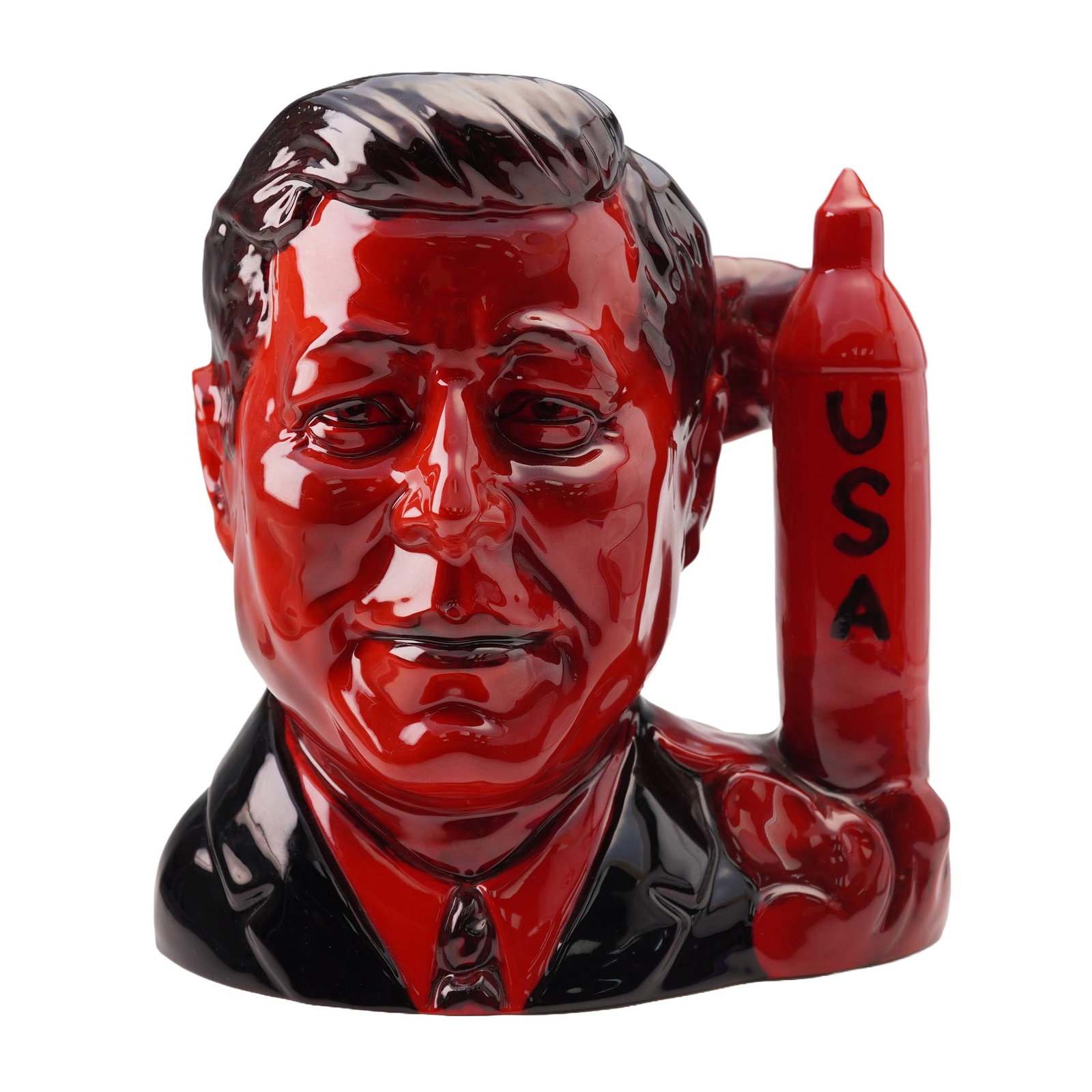 Peggy Davies Studios Ruby Fusion Character Jug, John F. Kennedy: This large J.F. Kennedy Character Jug was created by Peggy Davies Studios as part of the American Patriots series. Featuring a detailed likeness of President Kennedy, the jug includes a unique USA roc