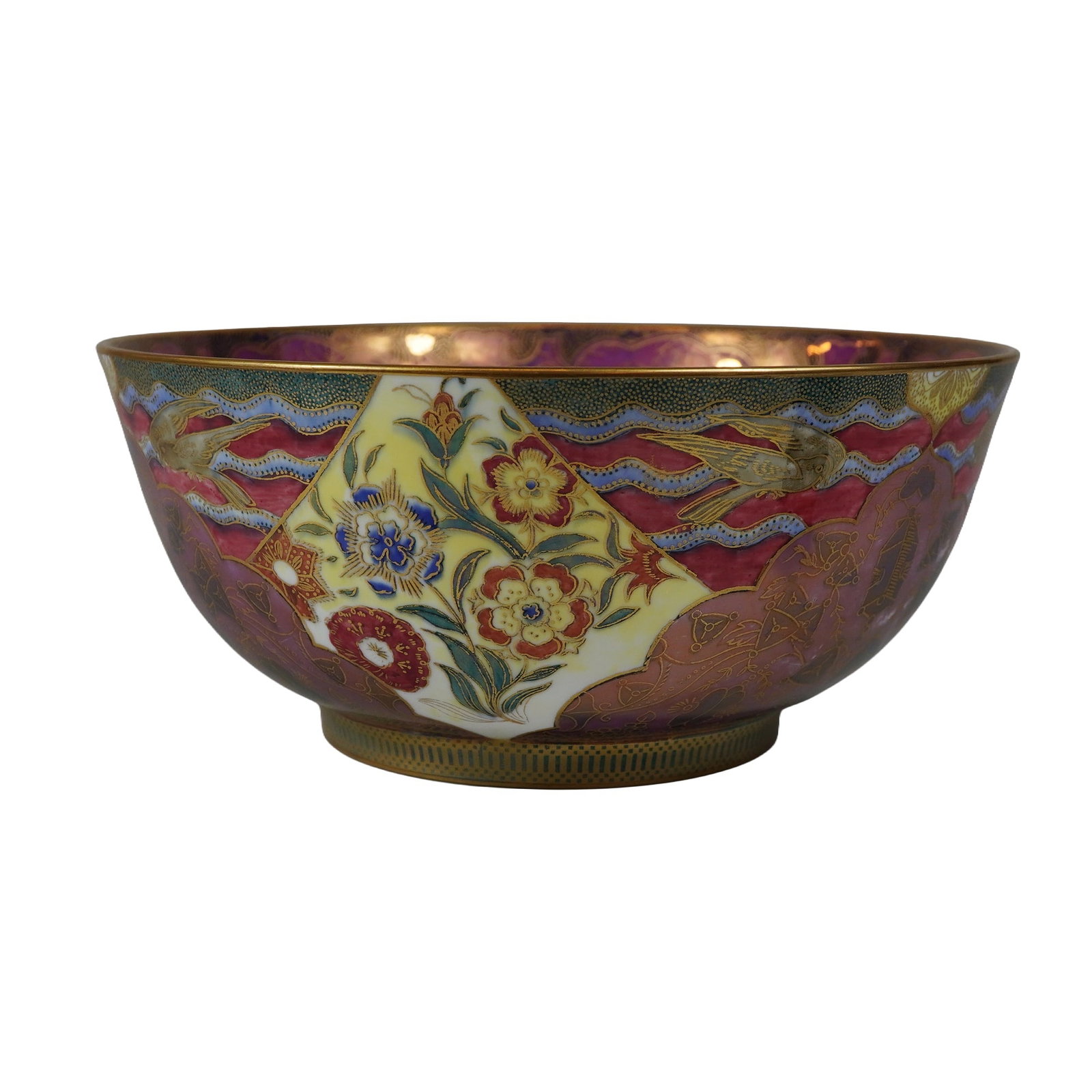 Wedgwood Imperial Bowl in Daventry Red Luster Pattern: A Wedgwood bone china Imperial bowl decorated in the Daventry pattern, designed by Daisy Makeig-Jones, circa 1920s. The exterior features a mottled magenta ground embellished with gilded foliate scrol
