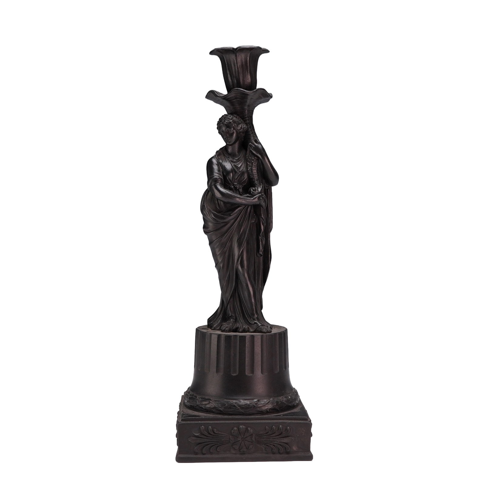 Wedgwood Black Basalt Figural Candlestick: A Wedgwood black basalt stoneware candlestick featuring a classically draped Ceres. The figure is depicted holding a fluted cornucopia that serves as the candle nozzle, finished with a scalloped rim. 