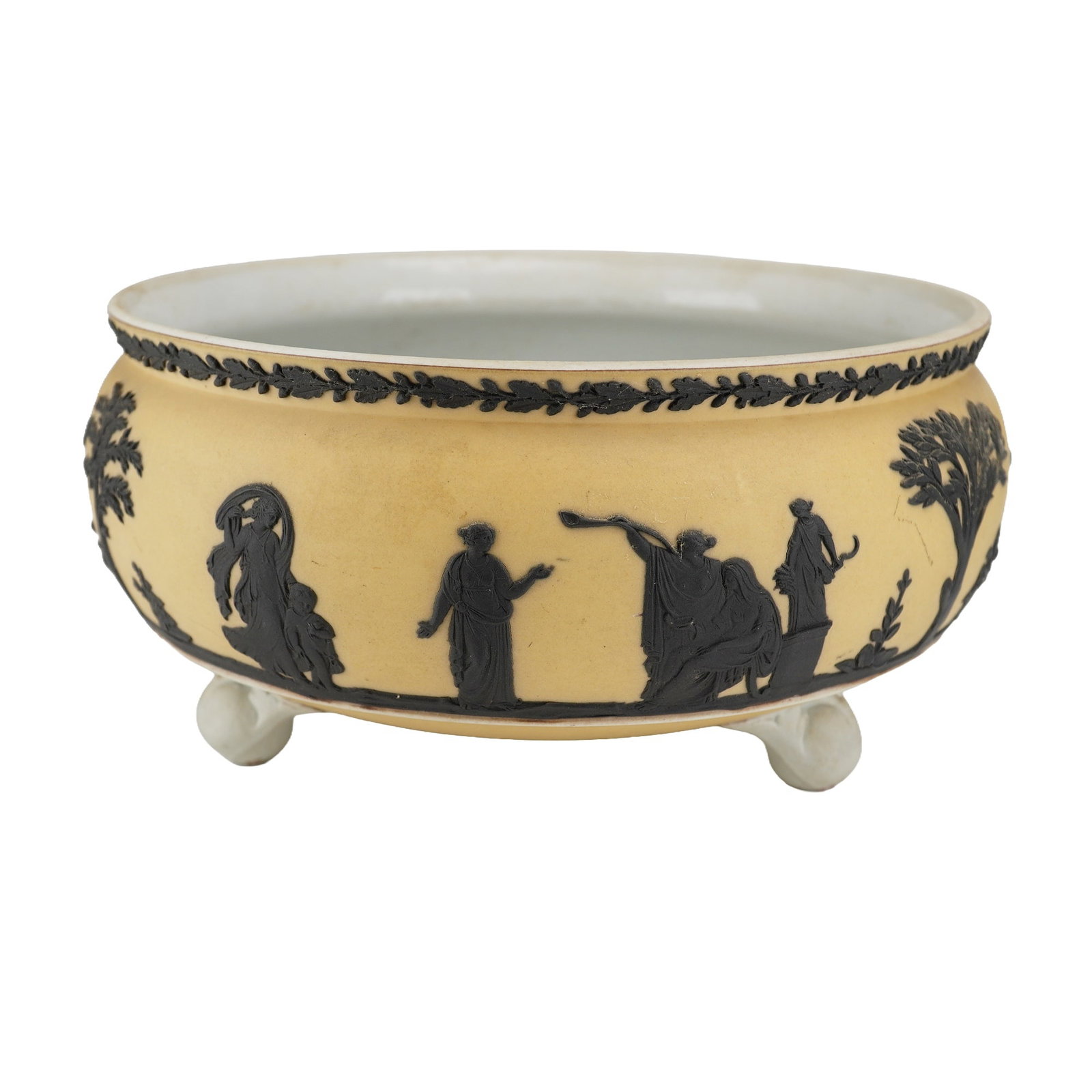 Wedgwood Primrose Yellow and Black Jasperware Footed Ferner Bowl: A circular tripod bowl, commonly referred to as a ferner or imperial bowl, manufactured by Wedgwood in primrose yellow dipped jasperware with black basalt bas-relief decoration. The exterior body feat