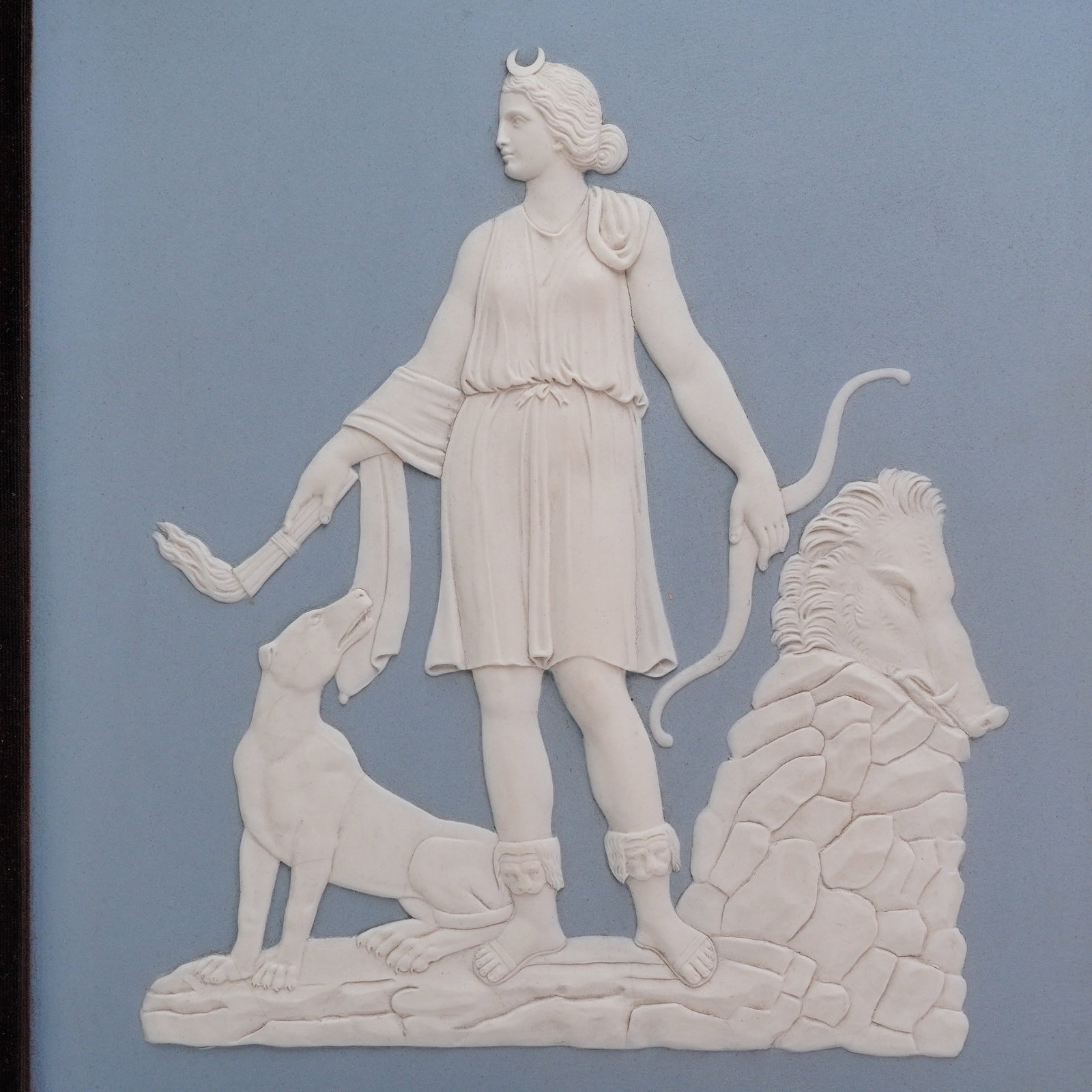 Wedgwood Bert Bentley Solid Light Blue Jasperware Plaque of Diana the Huntress: A rectangular solid light blue jasperware plaque produced by Wedgwood, featuring a white bas-relief depiction of Diana the Huntress. This piece is attributed to the celebrated Wedgwood modeler Bert Be