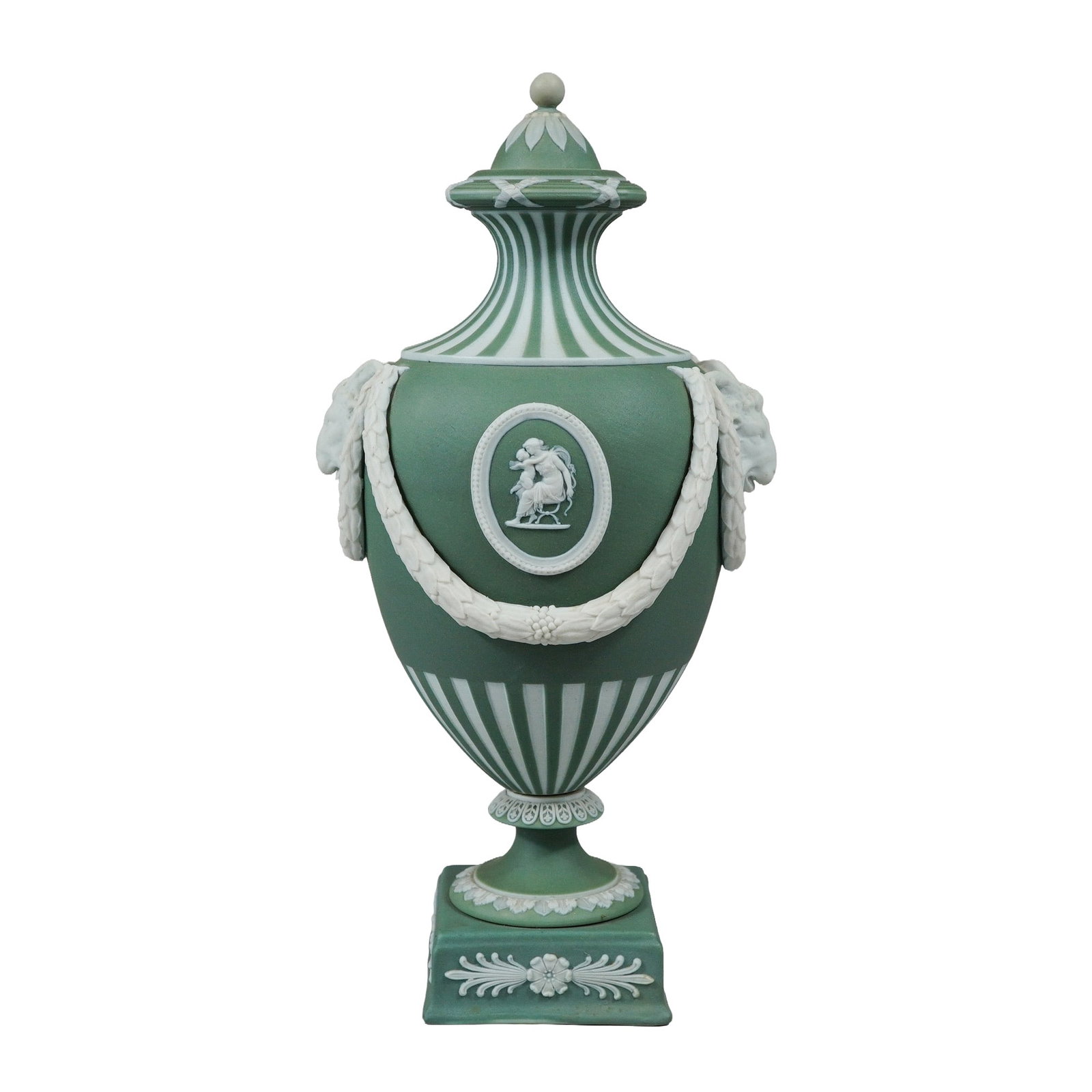 19th Century Wedgwood Sage Green Jasperware Covered Urn: A 19th-century Wedgwood sage green jasperware covered urn featuring classical-style white bas-relief decoration. The vessel is of ovoid form with a tall, waisted neck and is mounted on a separate, att