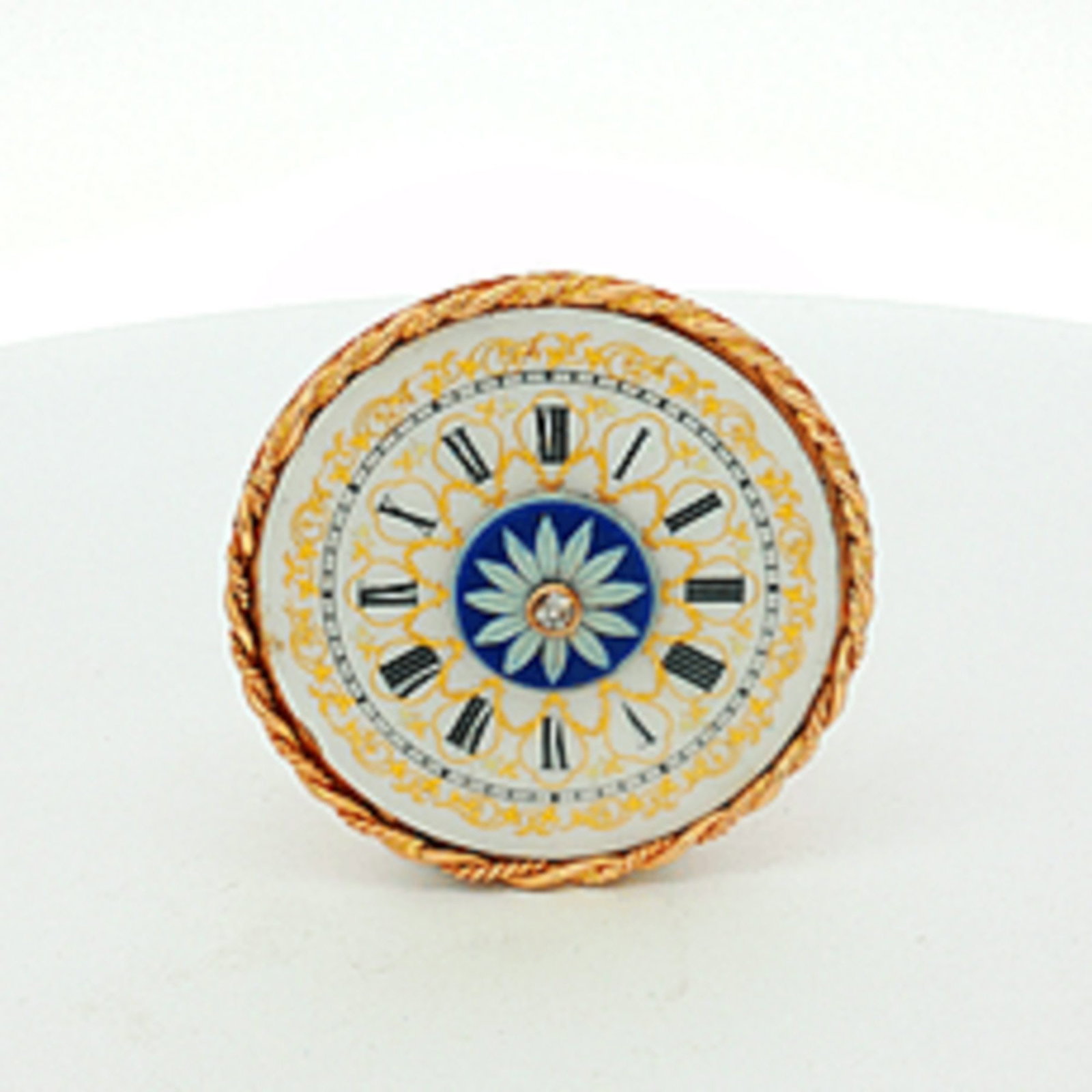 14K Gold Wedgwood Jasperware Watch-Face Brooch Pendant with Diamond Accent: A circular 14 karat yellow gold brooch by Wedgwood, designed with a watch-face motif. The centerpiece features a blue and light blue floral design on jasperware, accented with a single round-cut diamo