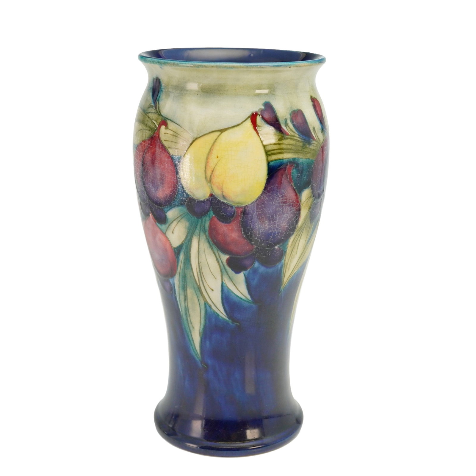 Moorcroft Pottery Vase, Wisteria: Baluster shaped vase colored in plum and cream with fruits and leaves on a cobalt blue background. Moorcroft signature on base. Dimensions: 4"W x 8"H Manufacturer or Brand: Moorcroft Country of Origin