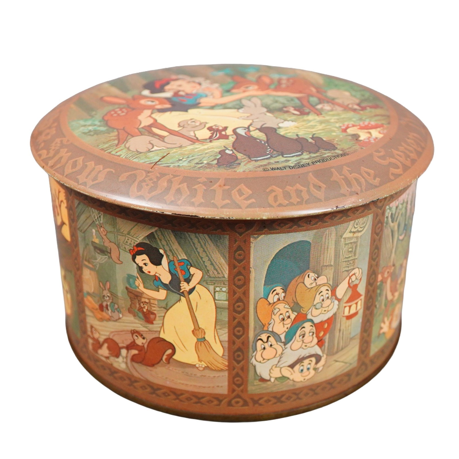 Daher Walt Disney Snow White and the Seven Dwarfs Tin Box: A lidded tin box decorated with scenes from the classic Walt Disney animated film Snow White and the Seven Dwarfs. The underside bears the Daher manufacturer stamp. Dimensions: 5.25"W x 3"H Provenance