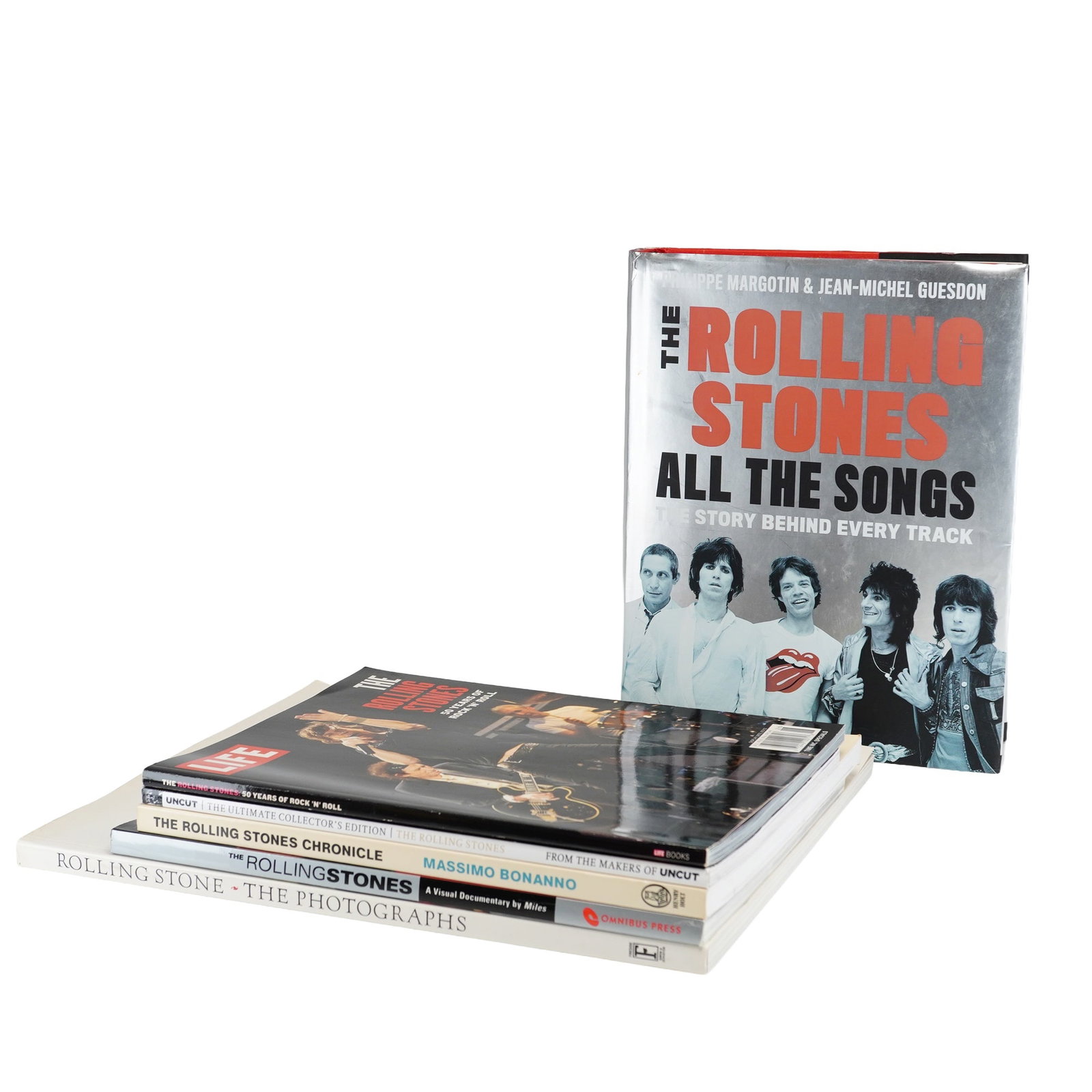 6pc Collection of Rolling Stones Hardcover and Softcover Books and Magazines: This 6pc collection comprises a selection of bibliographic works and periodicals chronicling the career of the English rock band, The Rolling Stones. The primary volume is The Rolling Stones All the S