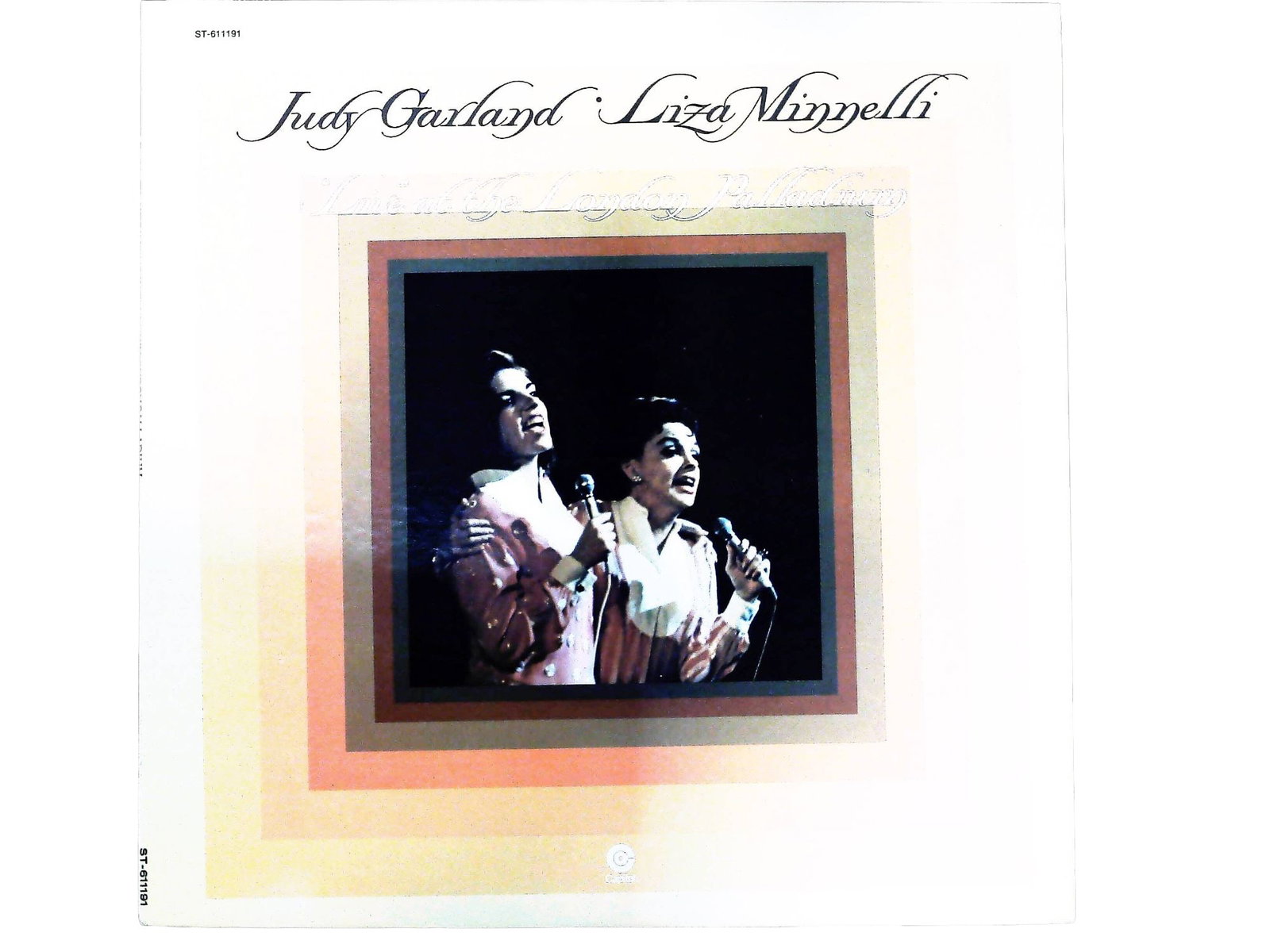 Judy Garland & Liza Minnelli "Live" At The London Palladium 1972 Capitol LP: A 1972 pressing of the album Judy Garland & Liza Minnelli "Live" At The London Palladium, released by Capitol Records. The lot consists of one (1) black vinyl LP housed in its original full-color prin