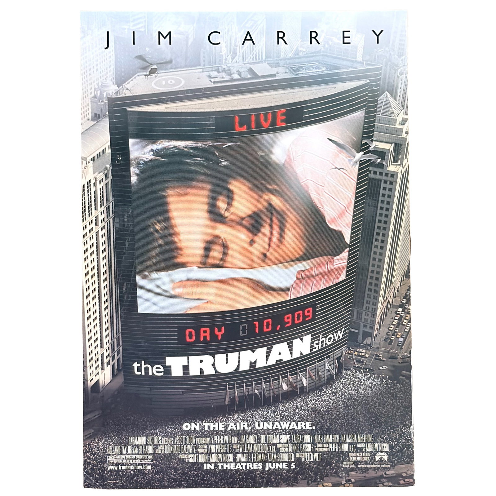 Original Double-Sided Teaser One-Sheet Movie Poster, The Truman Show Starring Jim Carrey/Peter Wier: Original advance teaser poster for the 1998 critically acclaimed masterpiece The Truman Show. This iconic "Mosaic" style teaser features a composite image of Jim Carrey's face made up of hundreds of t