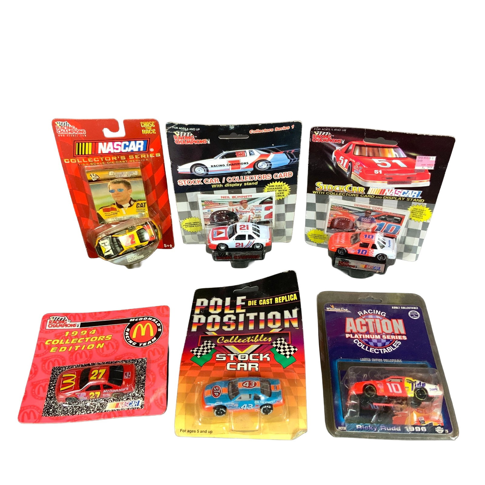 6pc NASCAR 1:64 Scale Die-Cast Stock Car Models: This collection consists of six individual 1:64 scale die-cast NASCAR stock car models, each contained within its original factory-sealed blister card packaging. The group features models from several