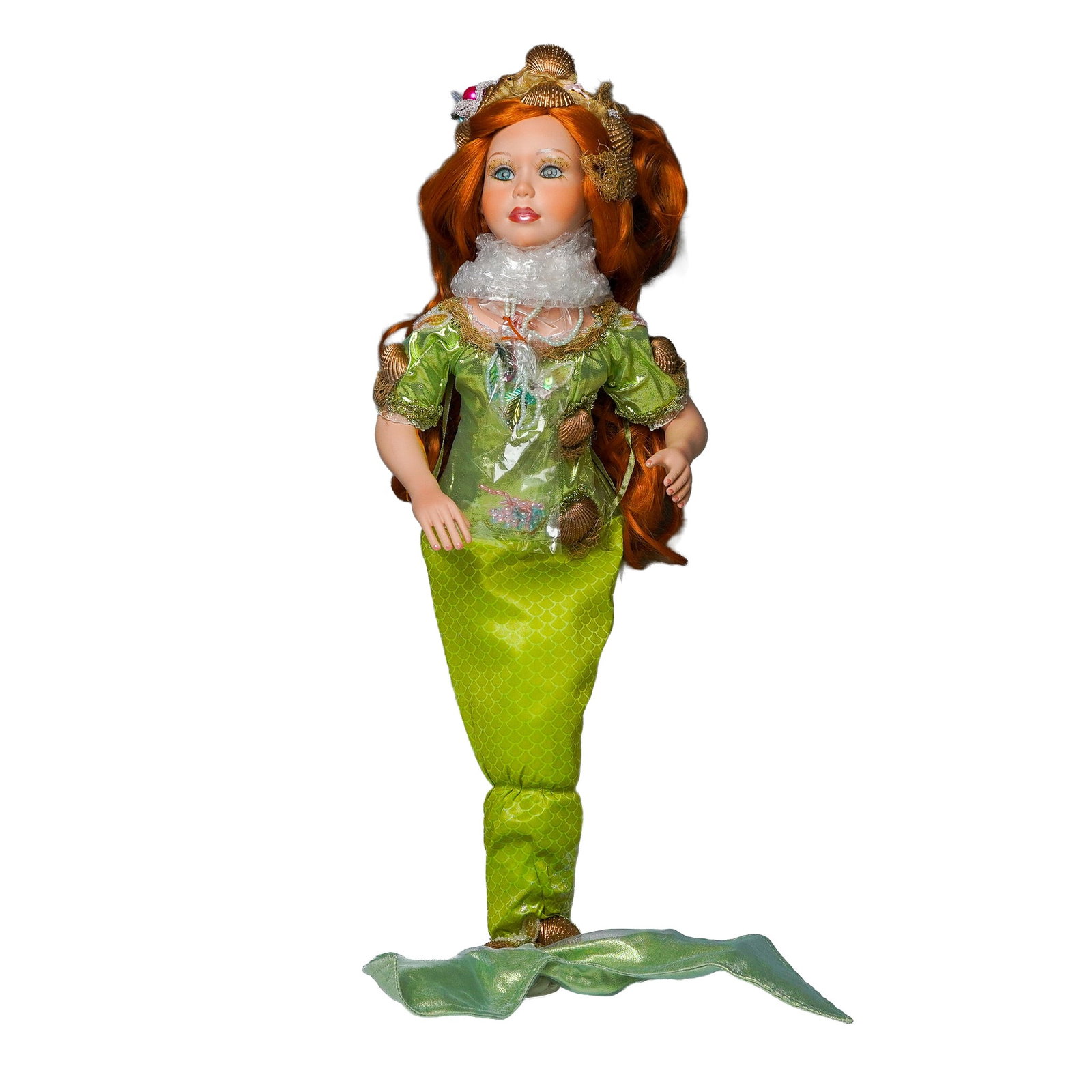 Show Stoppers Porcelain Mermaid Fairy Doll w Accessories and Shell Accents: This fantasy-themed porcelain collector doll features a unique mermaid-fairy hybrid design, dressed in a shimmering green costume with shell embellishments and glittering details. Her long red hair is