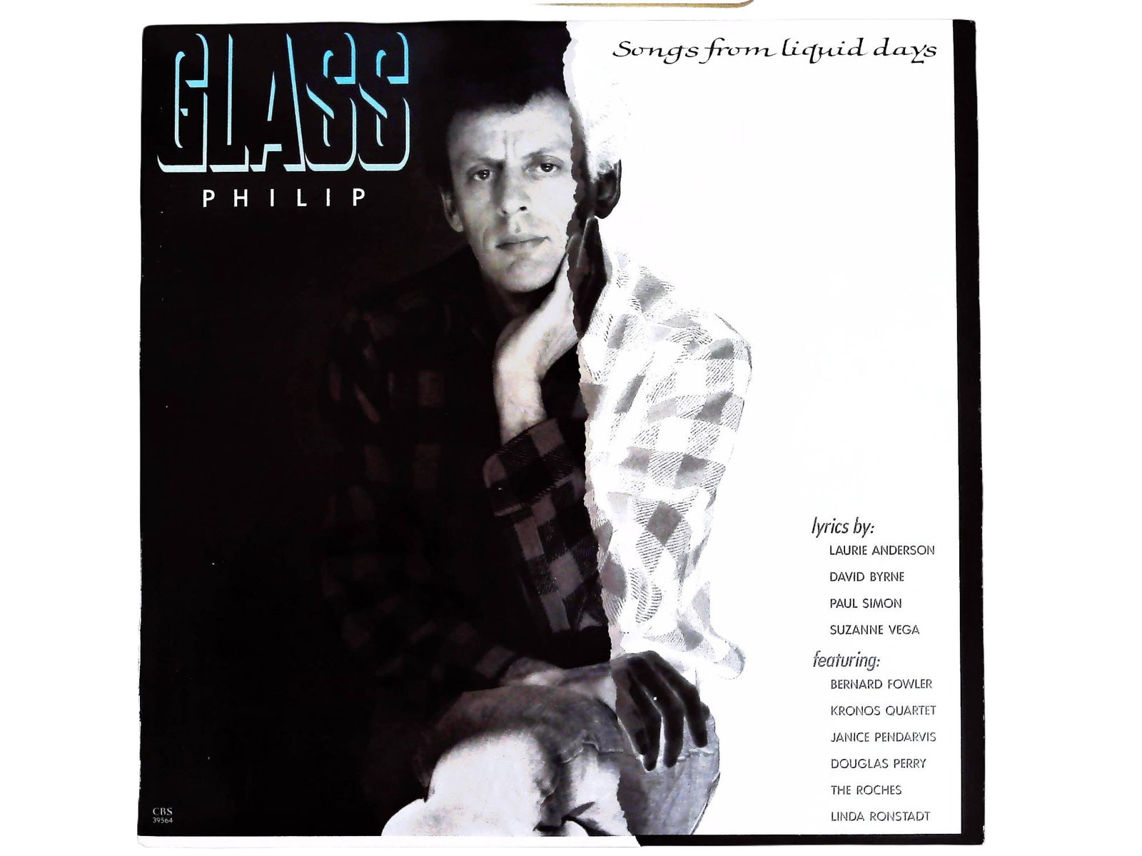 Philip Glass Songs From Liquid Days 1986 Vinyl LP CBS Records FM 39564: This lot features a 1986 vinyl LP pressing of Philip Glass's Songs from Liquid Days, released under the CBS FM label (FM 39564). The record in original album cover represents a collaborative song cycl