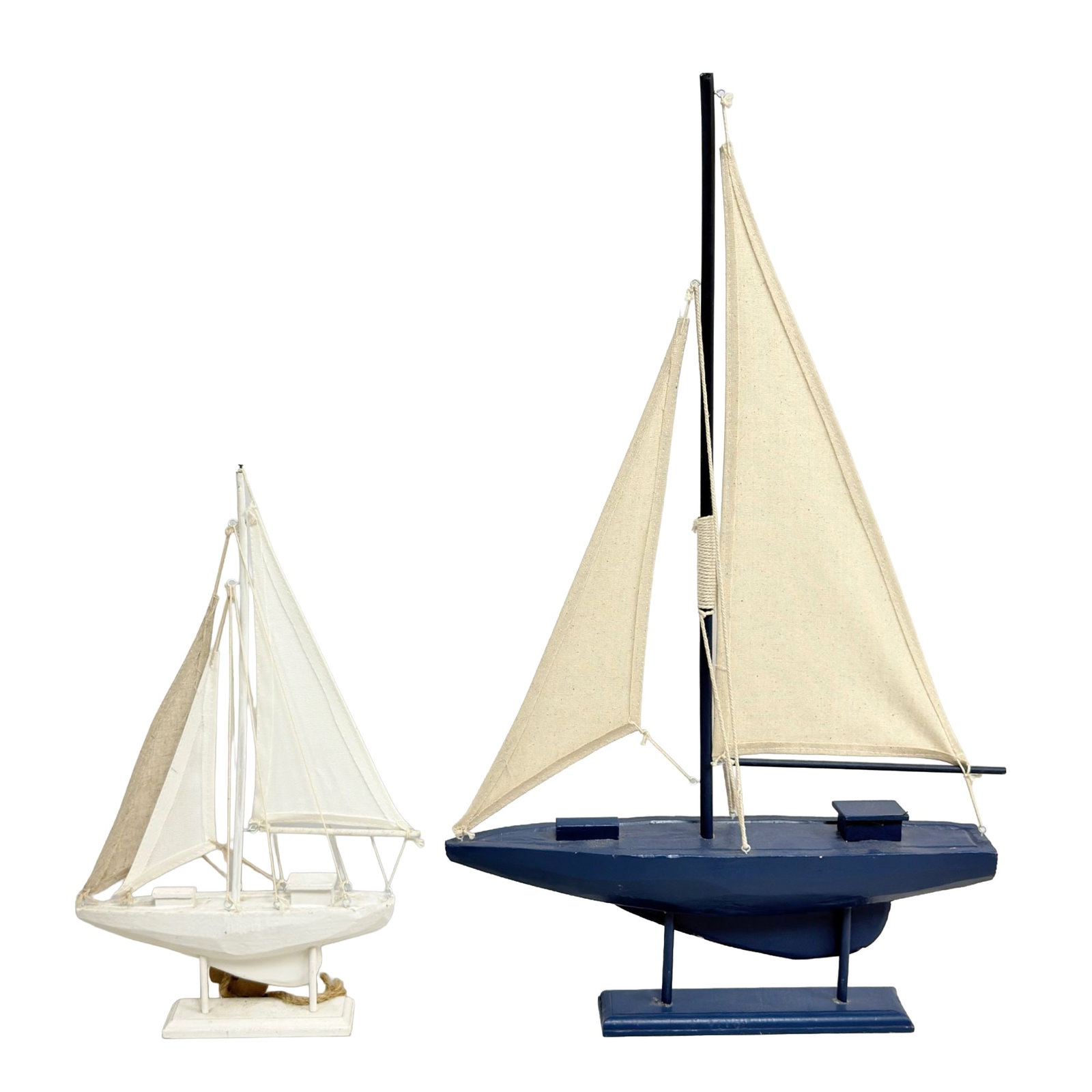 2 Wooden Sailing Boats Decorative Models: A group of contemporary decorative wooden sailing boat models designed for interior display. These vessels are constructed with carved and painted wooden hulls and bases, featuring fabric sails and me